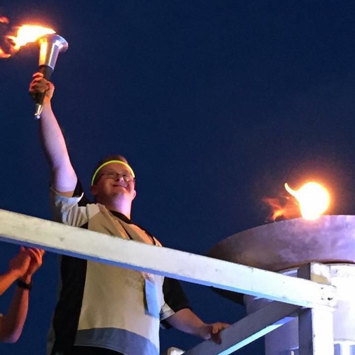 Seth Dame lights the torch to signify the start of the 2016 Rhode Island Special Olympics at the University of Rhode Island back in June.