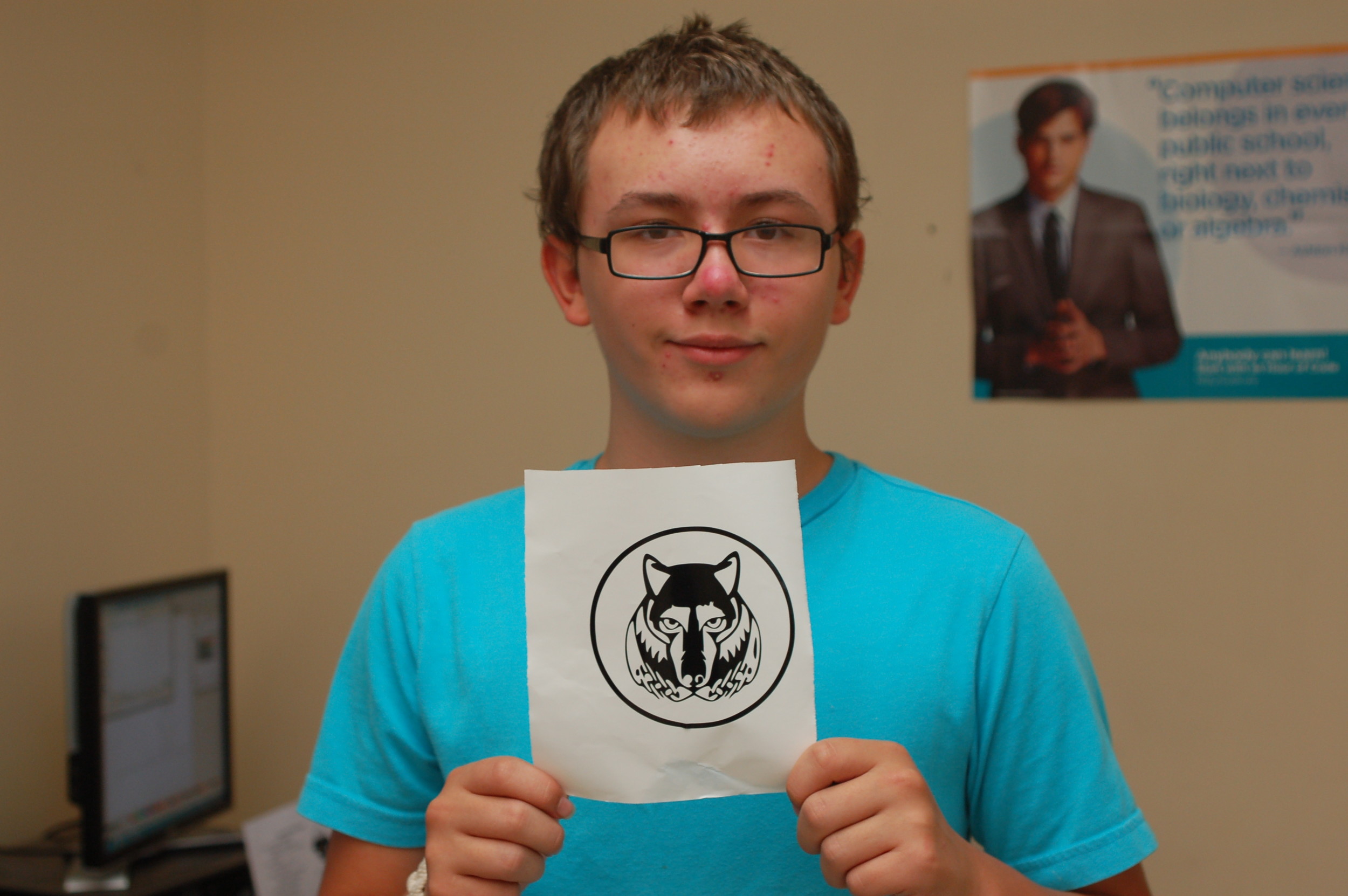 Lucian Sullivan, an 8th grader at Thompson Middle School in Newport, shows off the wolf sticker he made in Amie Shinego's technology class.