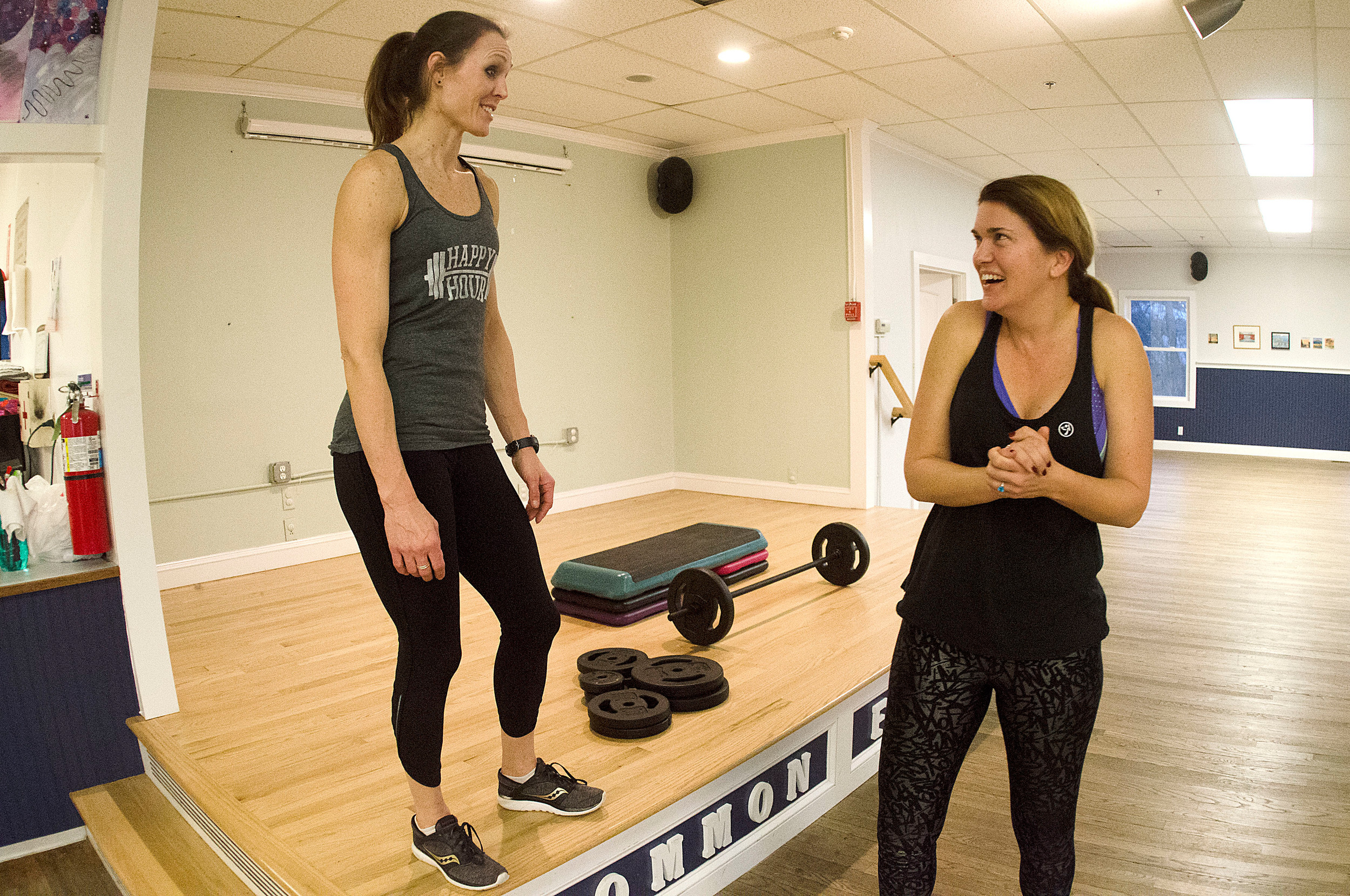 Body Pump instructor Shelly Marston (left) and Conley Zani, the Common Fence Point Improvement Association’s director of development, chat before a class last week.