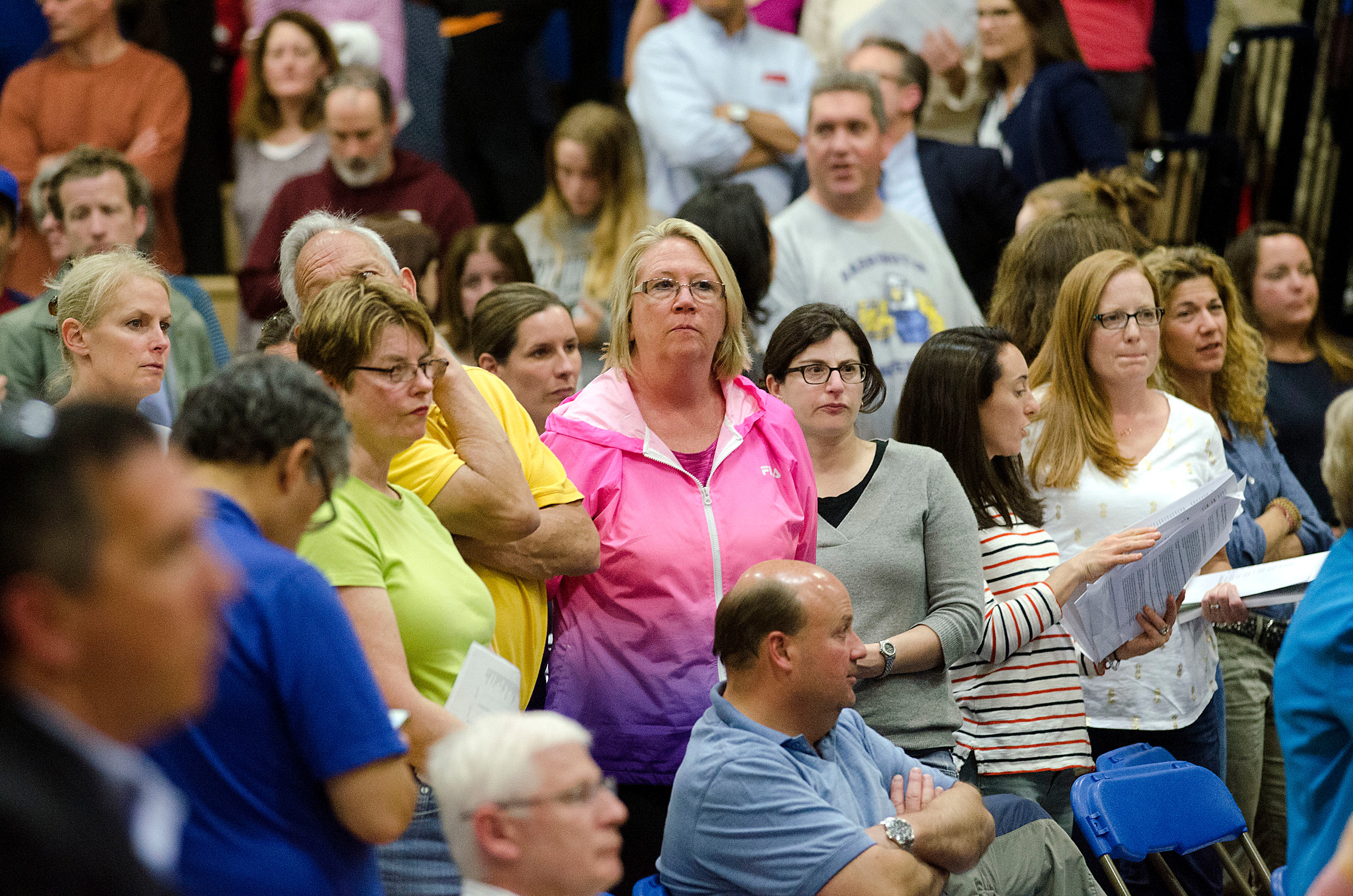 Residents stand and vote to add $402,000 to the school budget.