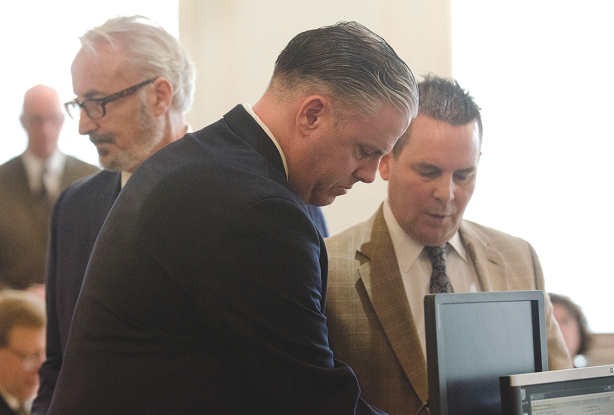 Lt. Timothy Panell (center), flanked by his lawyer Norman L. Landroche Jr. (right) and prosecutor John Bernardo (left) in 2nd District Court, Nov. 3, 2016 at one of nine (repeatedly continued) pre-trial conferences.
