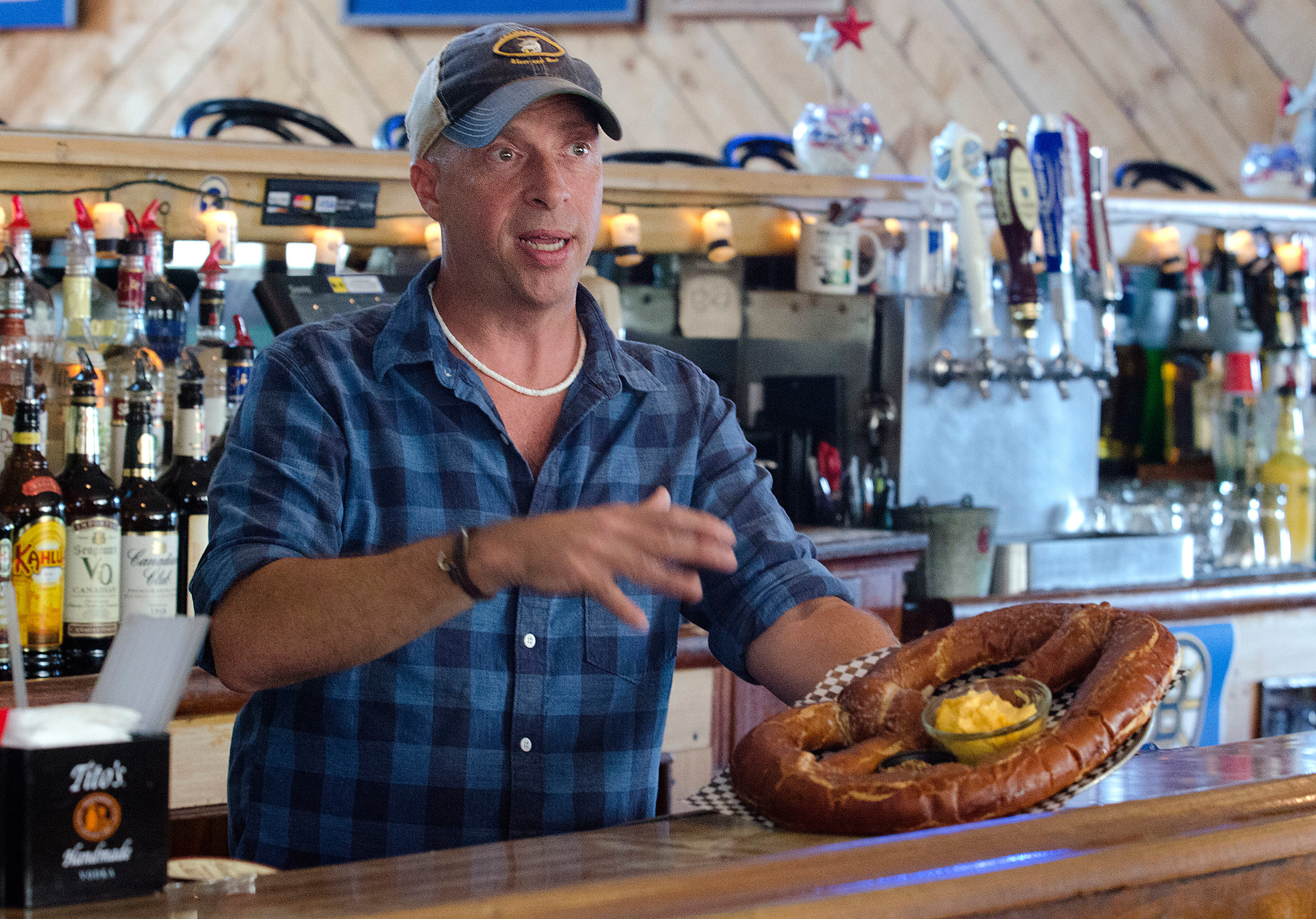 Mike Macfarlane, with one of the more unusual offerings on Tremblay’s new menu: a Wisconsin Giant State Fair Pretzel, served with beer cheese sauce and whole grain mustard. He found it in a Milwaukee bar while traveling for his full-time job. The bar directed him to nearby Miller’s Bakery, which now ships the pretzels to him twice a week.