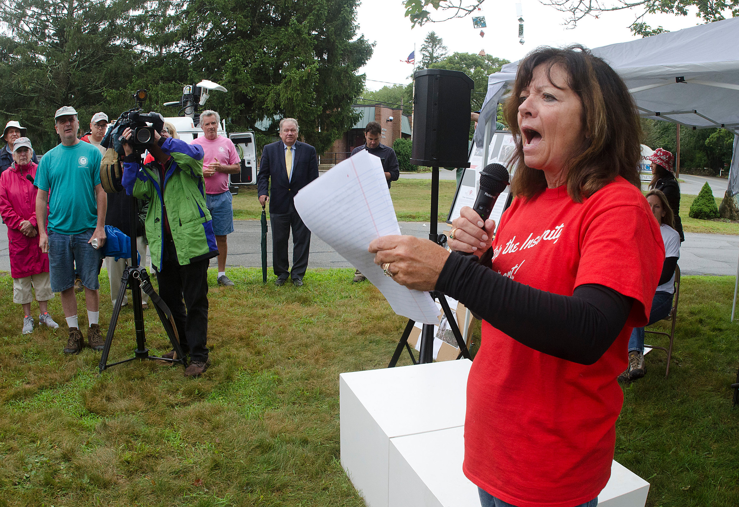 Barbara Pontolilo of Stop the Insanity, Westport speaks at an animal abuse rally in front of Westport Town Hall on Monday evening. She told her story of volunteering during the Medeiros tenant farm animal abuse case last year.