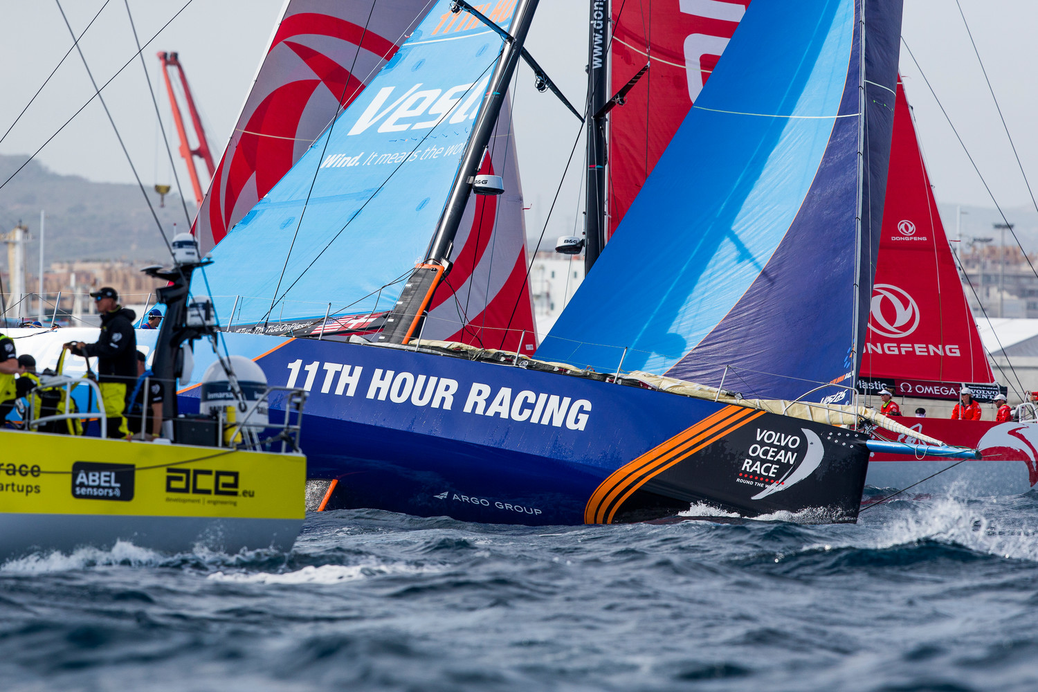Charlie Enright of Bristol steers Vestas 11th Hour Racing to the Volvo Ocean Race starting line at Alicante, Spain, Sunday at high speed in close quarters. Pedro Martinez/Volvo Ocean Race.