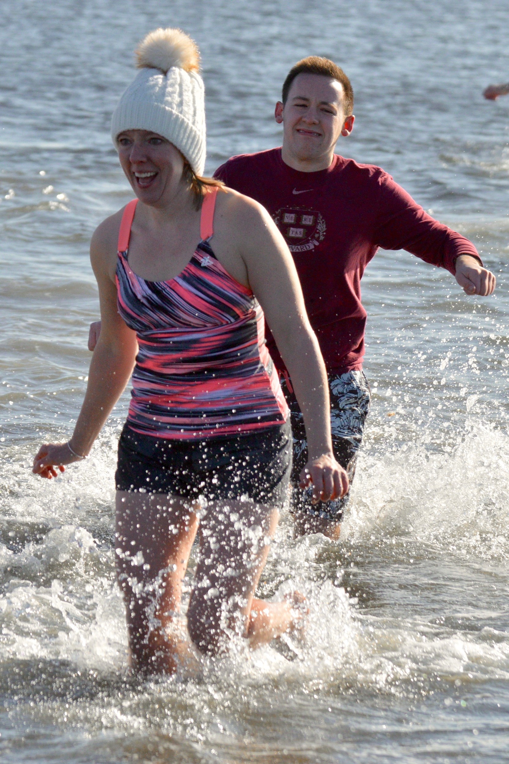 Melissa Reeve at least kept her head warm while she took the plunge. Her son Mickey, 19, also braved the frigid waters.
