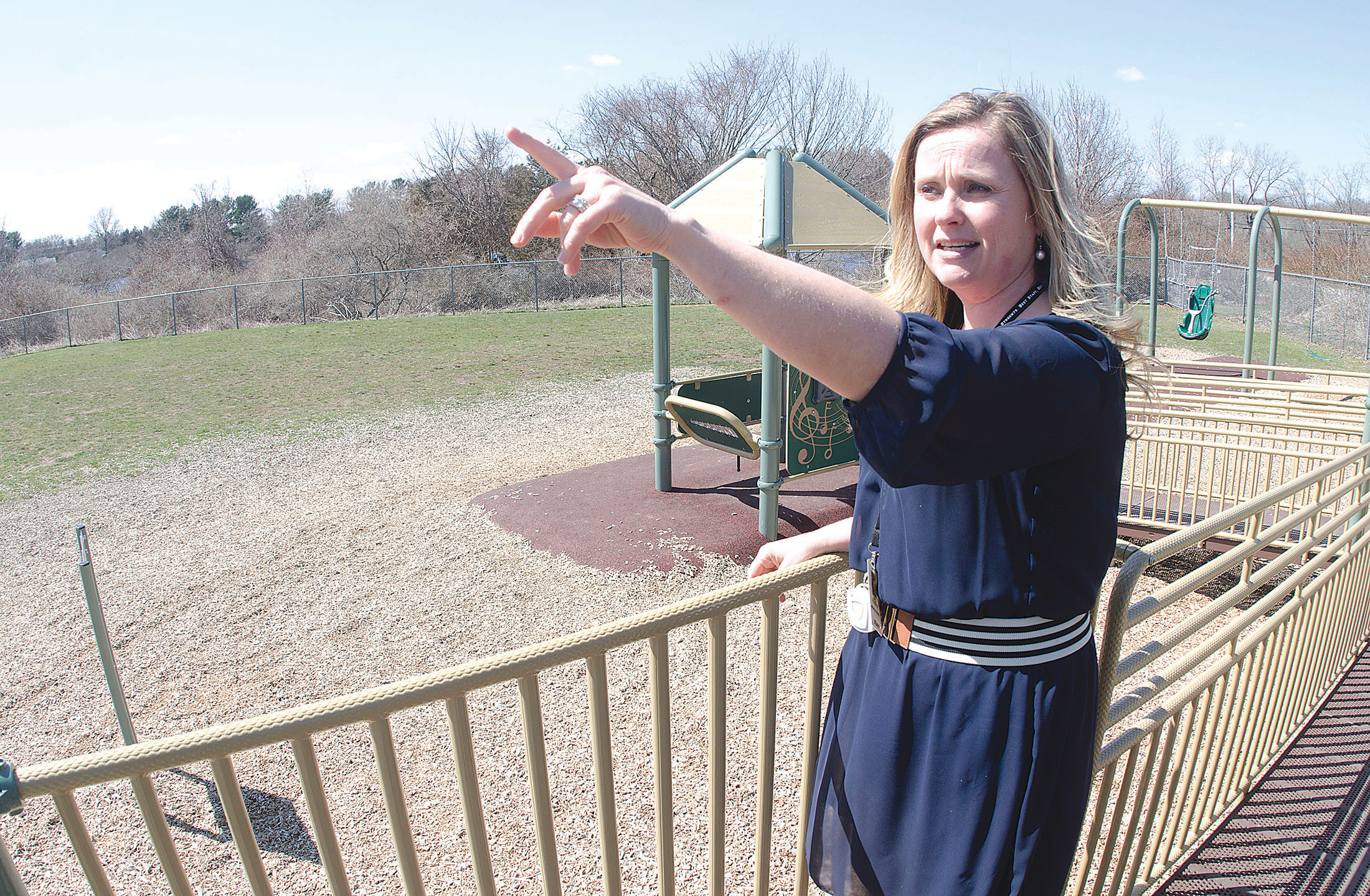 Elizabeth Viveiros, principal of Melville School, stands on the school’s new play structure, phase one of a project to establish a unique outdoor learning zone. An outdoor classroom would be located in the space at left.