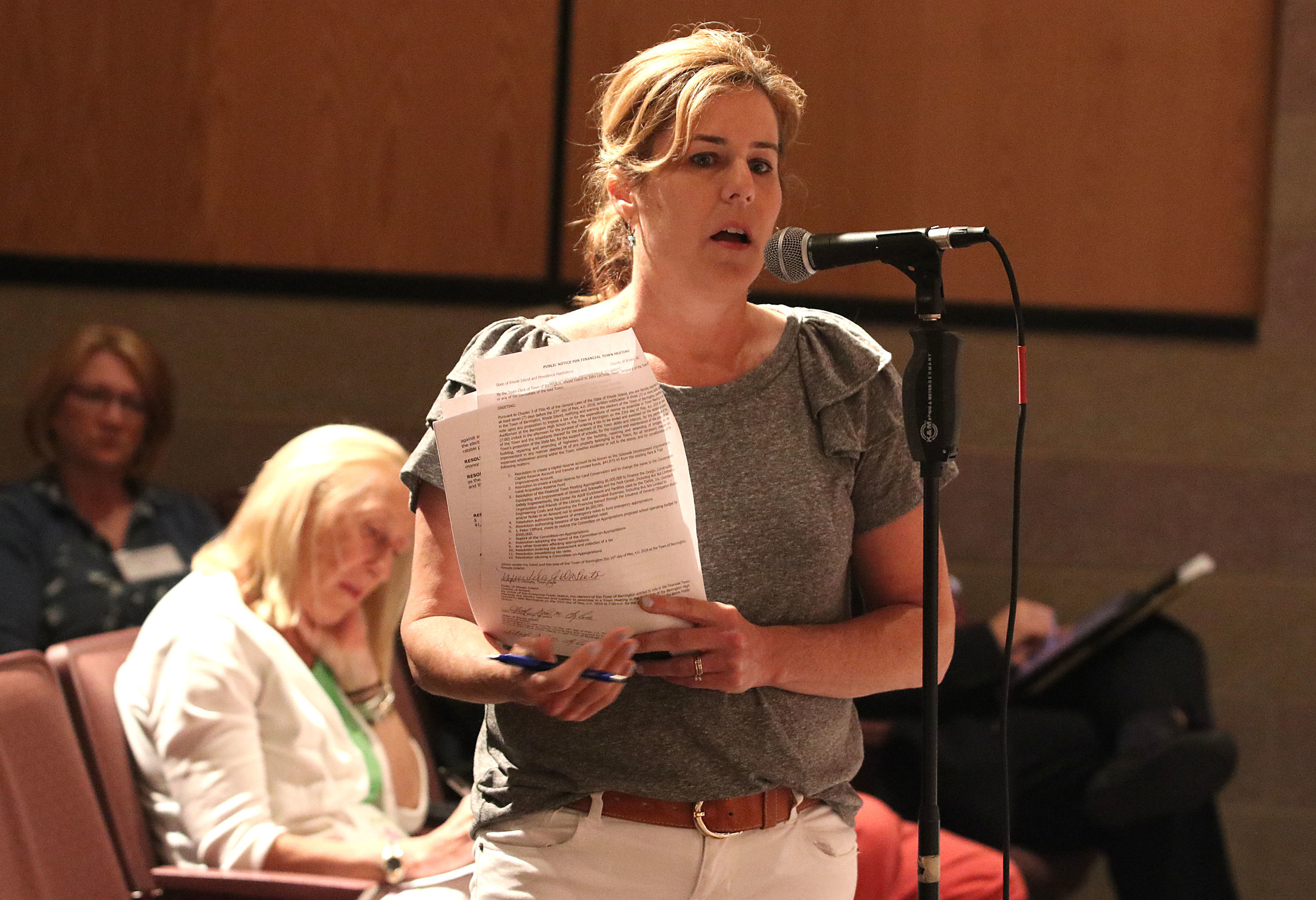 Dr. Lisa Daft tells people gathered at the financial town meeting that Barrington needs better balance in its budget.