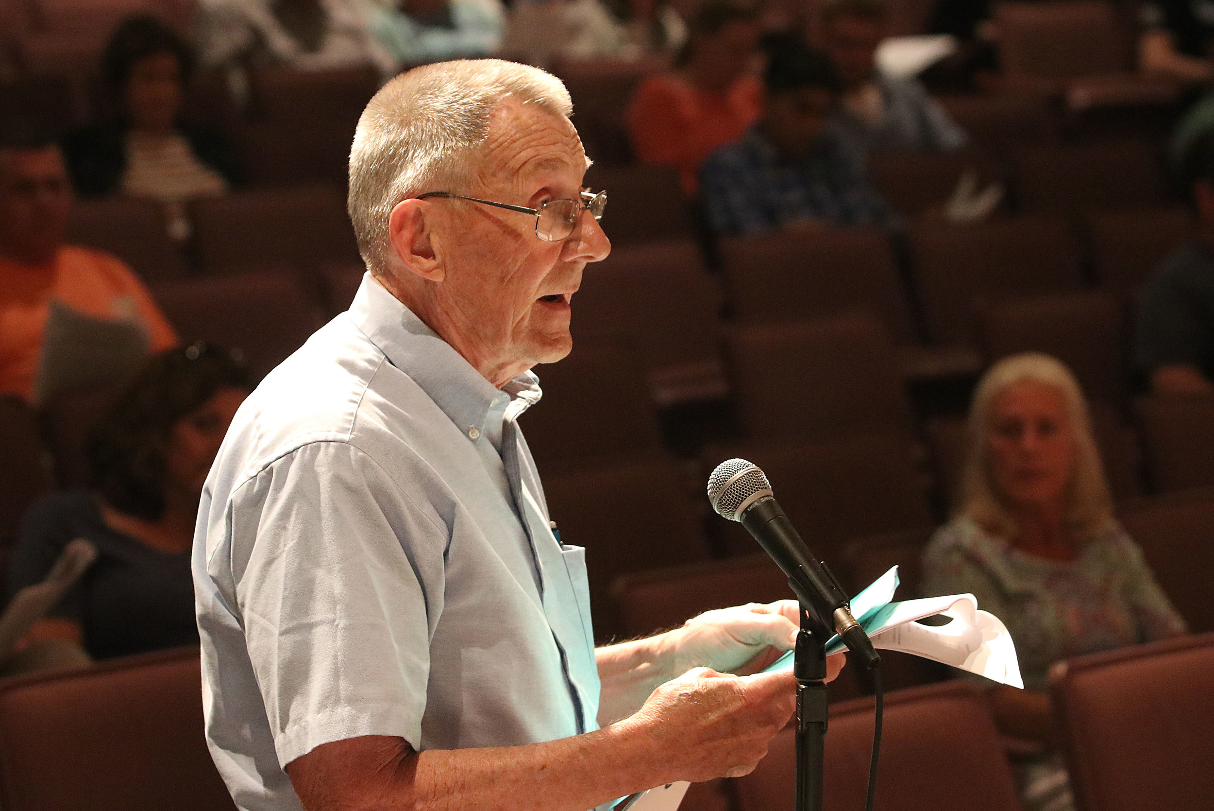 Barrington resident Peter Clifford explains his proposed $500,000 cut to the budget, during Wednesday's financial town meeting.