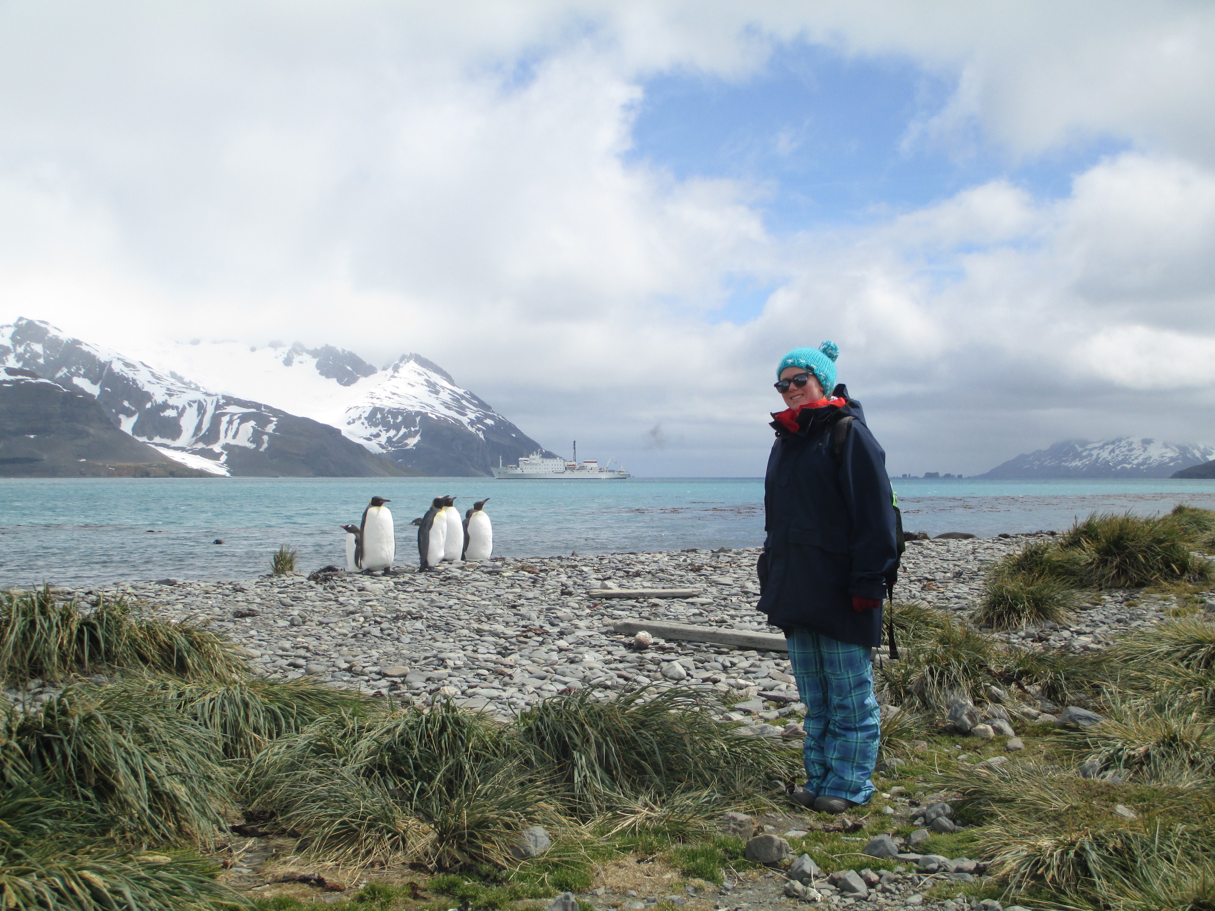 Breezy Grenier hangs with the penguins in Antartica in 2013.