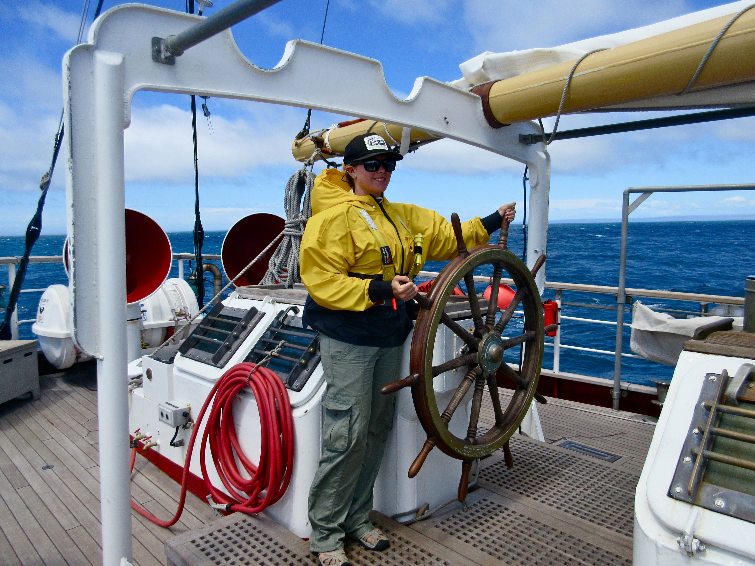 Manning the wheel during a Sea Education Association trip to New Zealand in 2014.