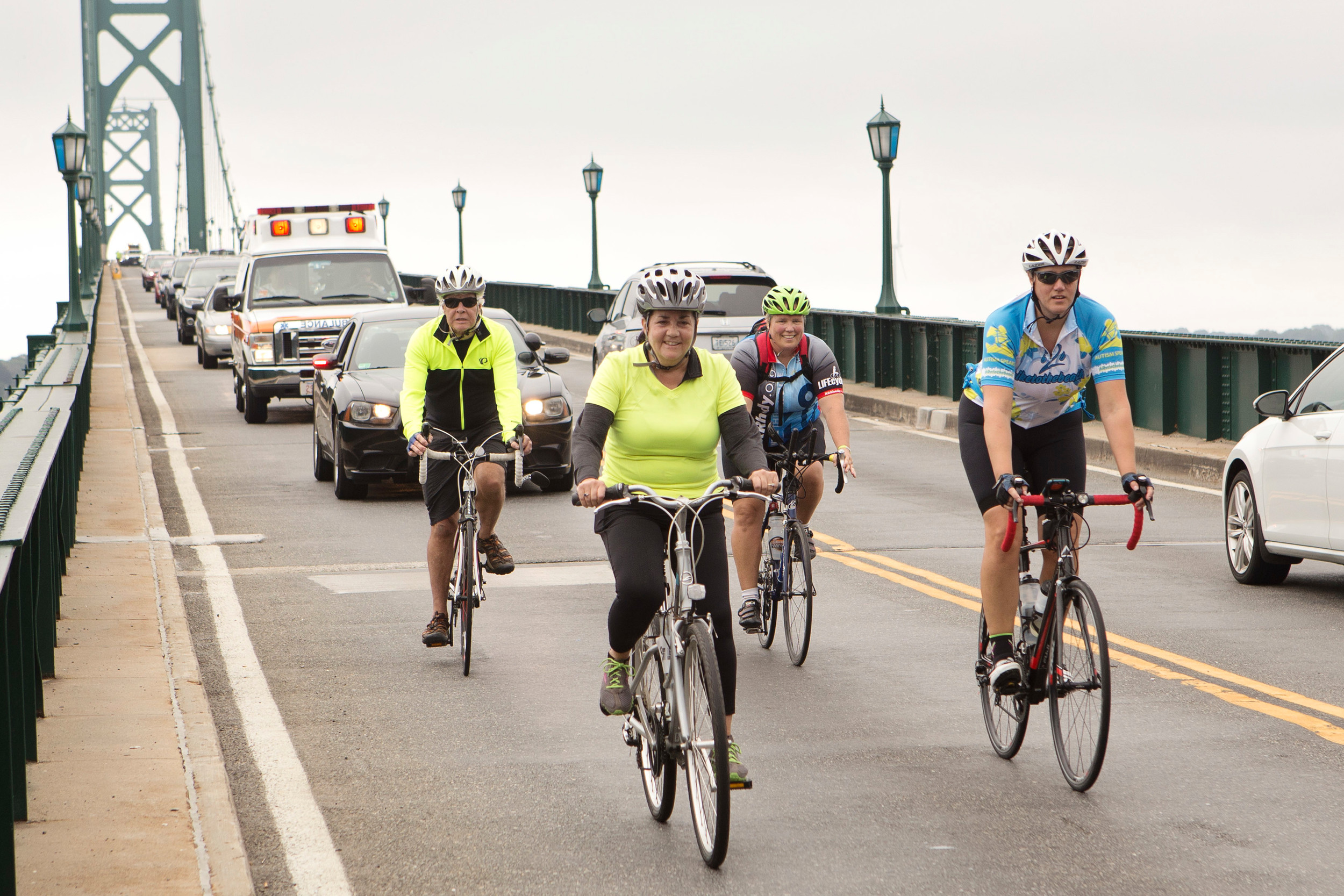 Bicyclists make their way across the Mt. Hope Bridge while nearing the finish line to the 4 Bridges Ride on Sunday.