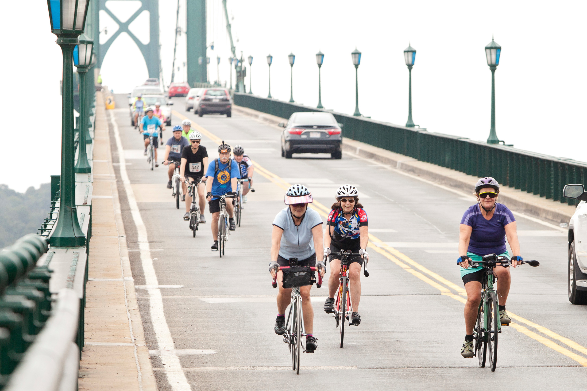 Bicyclists make their way across the Mt. Hope Bridge while nearing the finish line to the 4 Bridges Ride on Sunday.