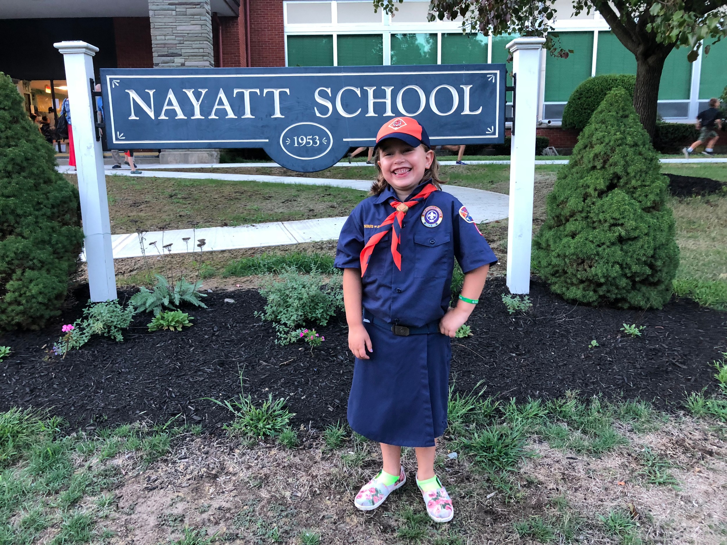 Liliana Colacchio, one of the newest members of Cub Scout Pack 1 Nayatt, stands in front of Nayatt School after registering last week. For the first time ever, girls signed up for the local Cub Scout pack.