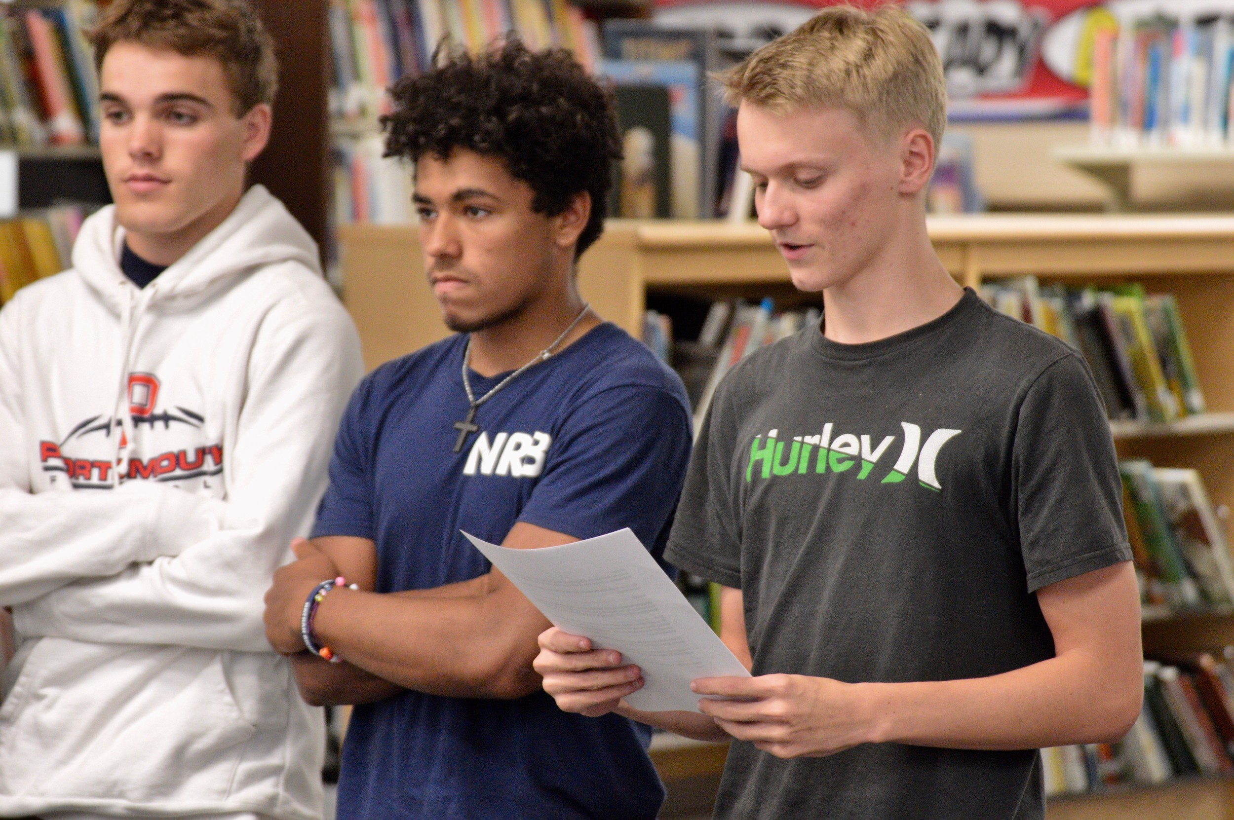 Owen Ross, a PHS junior and president of Every Student Initiative, explains how the group was formed after the suicide of their friend, Nathan Bruno, earlier this year. Connor Perry (far left) and Angel Duclos, wait their turn to speak.