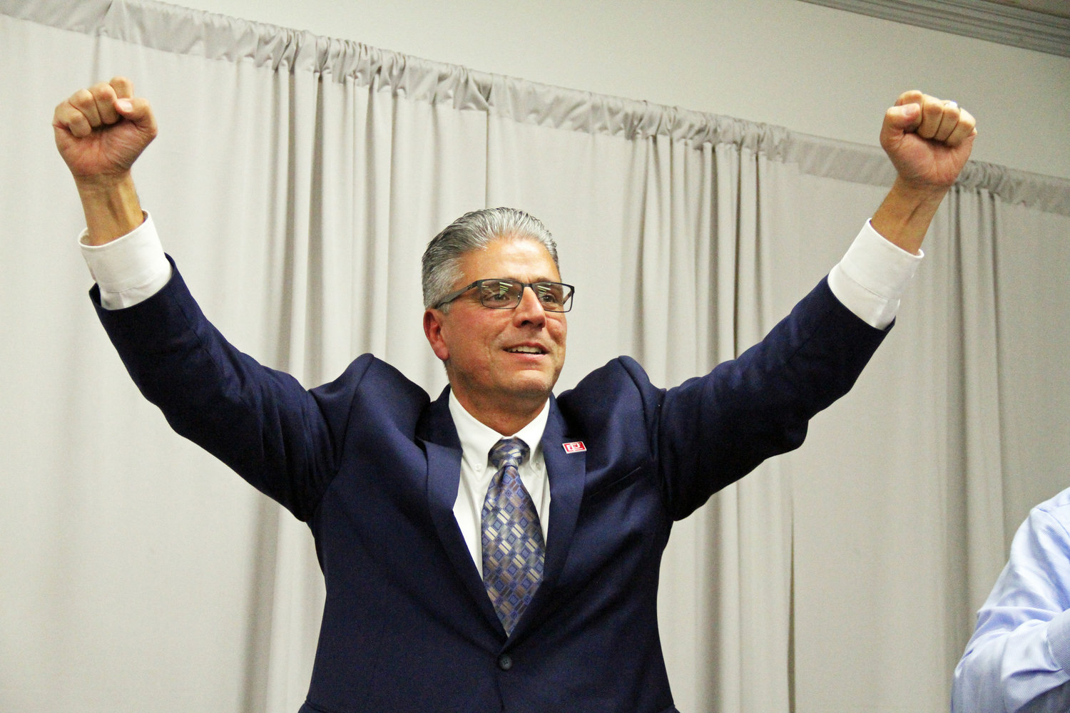Roberto DaSilva triumphantly responds to the results from the November 6 ballot, which saw him defeat James Russo to become East Providence's first elected mayor.