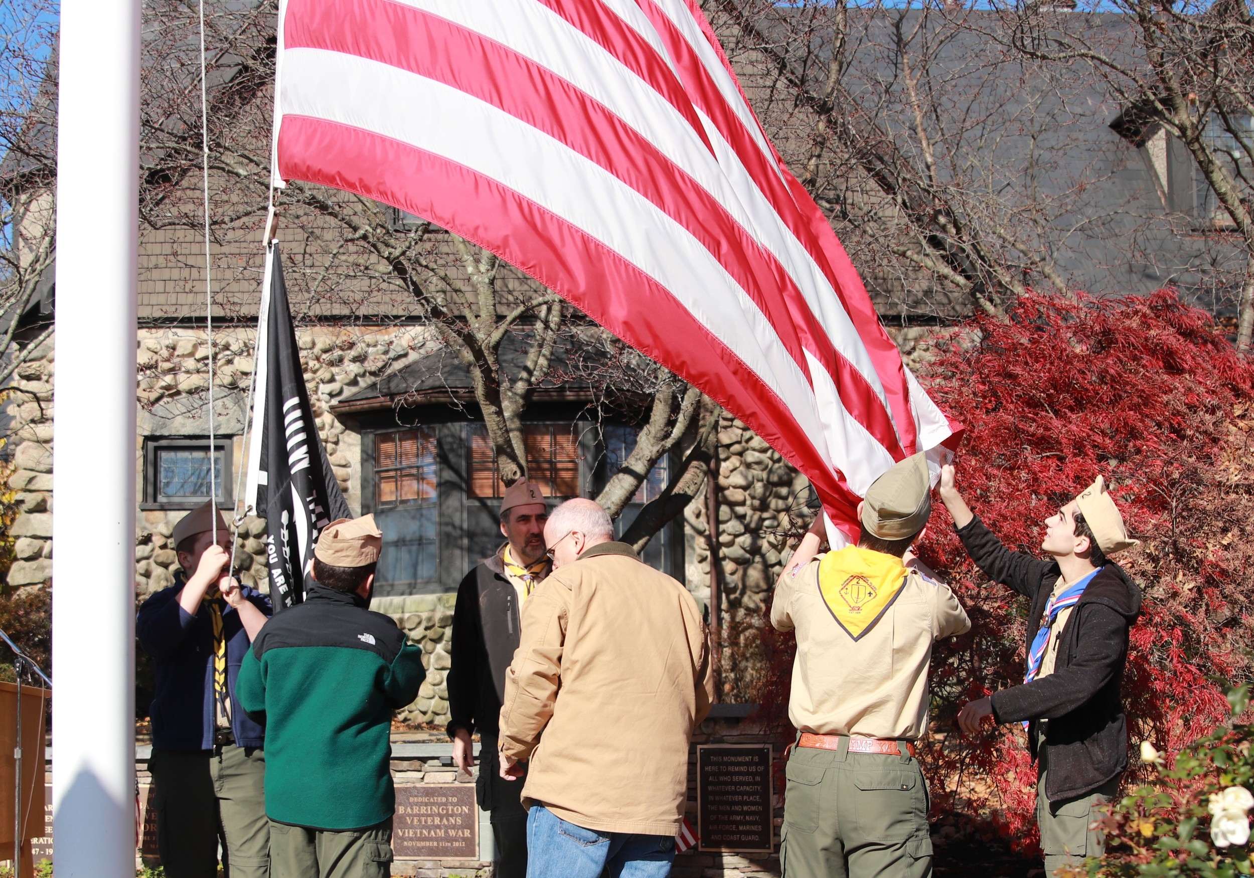 Members of a Barrington Boy Scout Troop raise the flag during a Veterans Day ceremony outside Barrington Town Hall a few years ago.