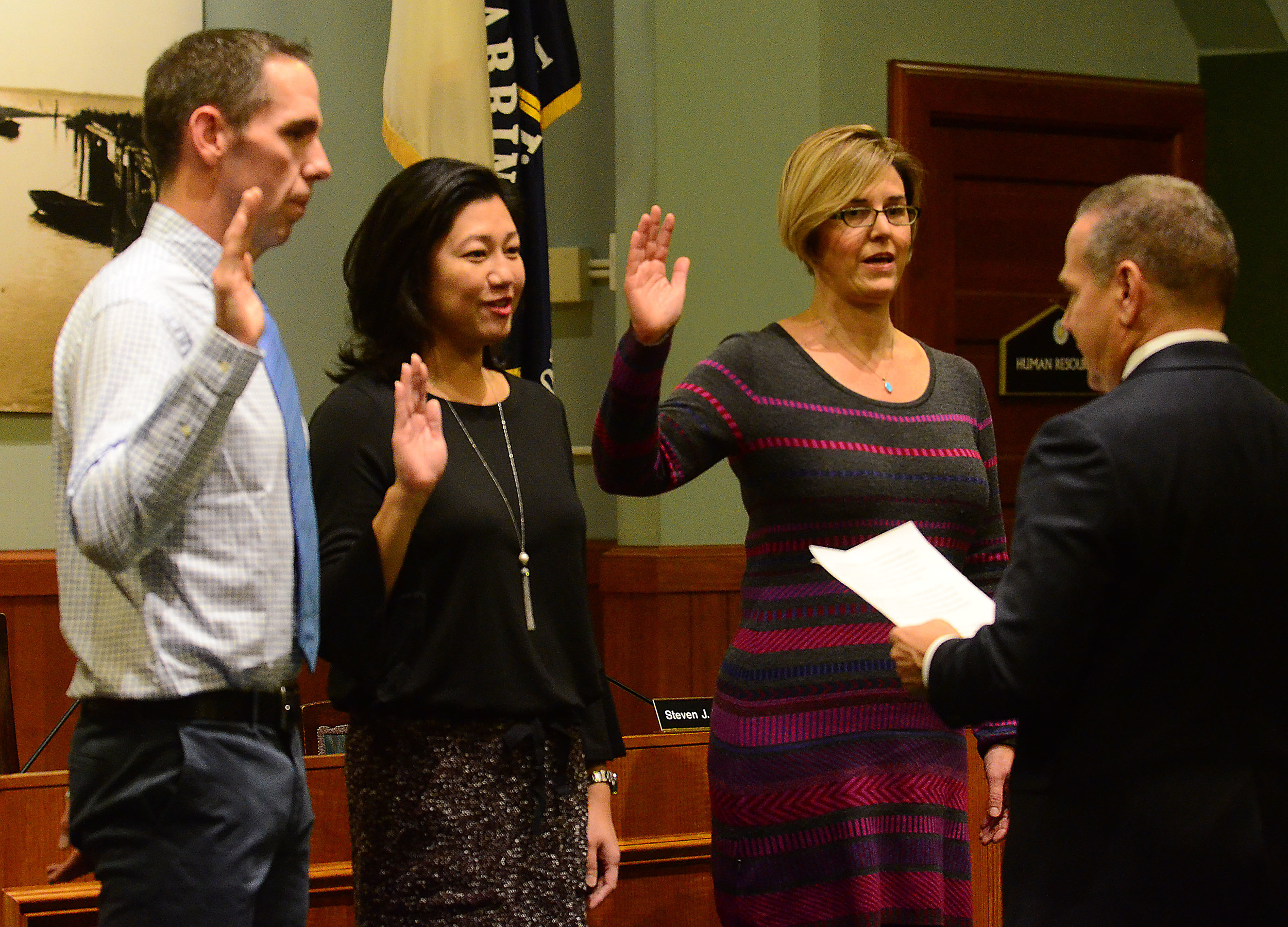 U.S. Congressman David Cicilline (right) administers the oath of office to Barrington School Committee members (from left to right) Patrick McCrann, Gina Bae and Erika Sevetson last year. Mr. McCrann voted against taking the school suspension fight to Superior Court, but the full committee voted 4-1 to proceed forward.