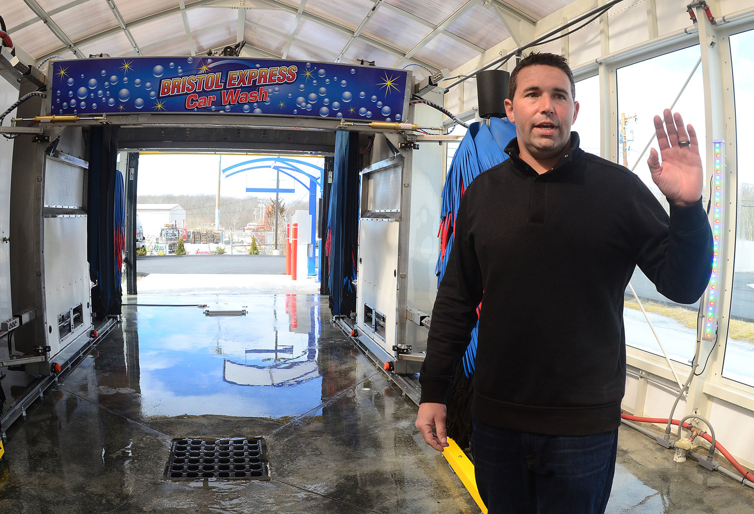 Bristol Express owner Zach Rivers explains the car wash system.