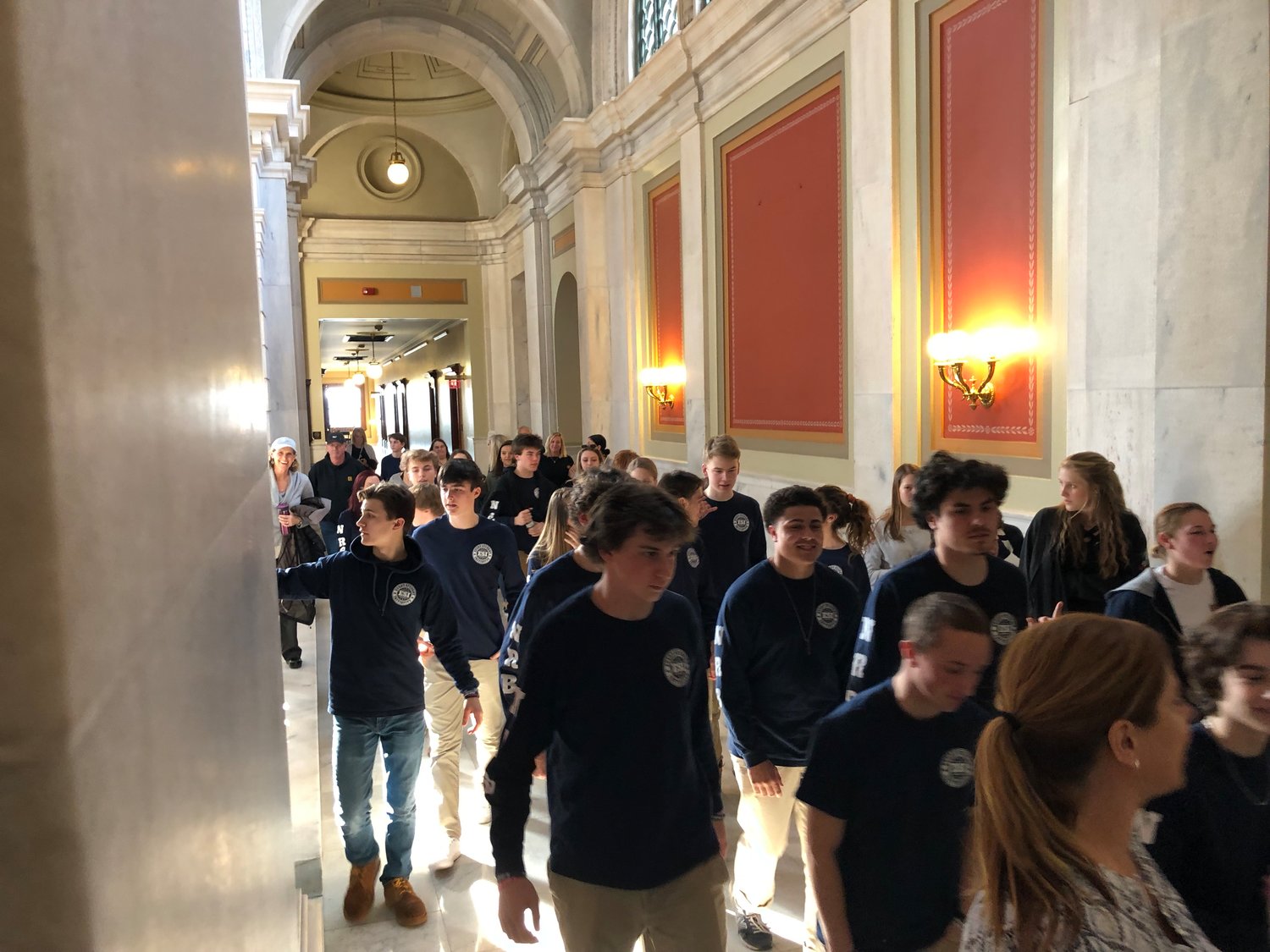 Every Student Initiative members walk to a Senate subcommittee hearing room after witnessing the bill be introduced in the House of Representatives.