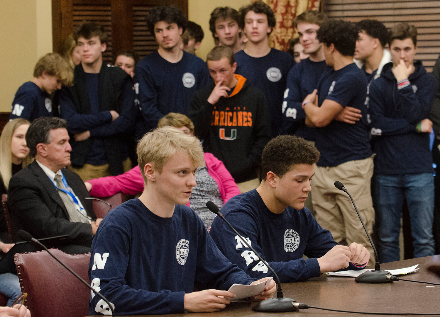 Owen Ross (left) and Marcus Evans, members of Every Student Initiative, testify before the Senate Committee on Education