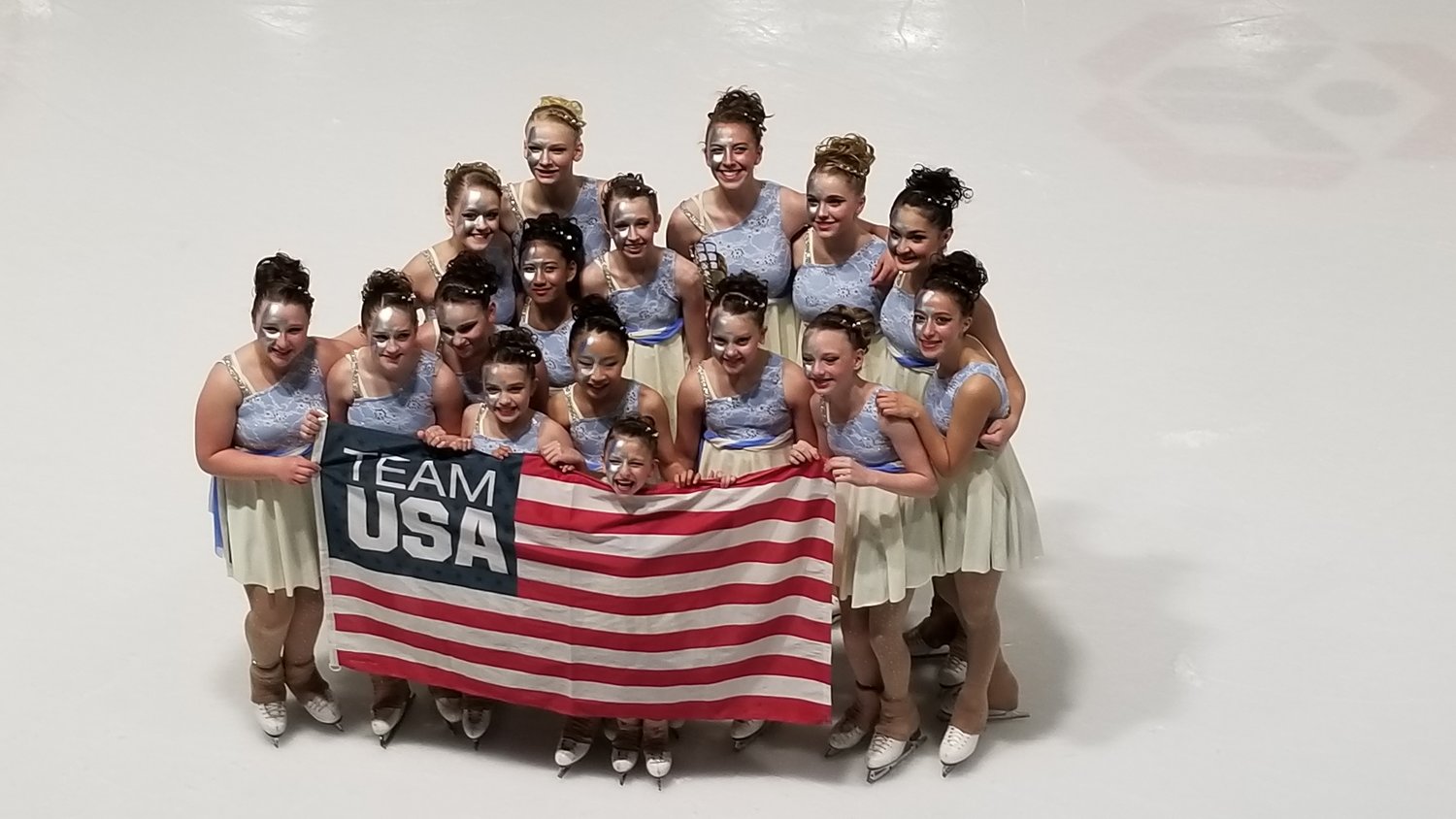 Members of the Ocean State Ice Theatre team celebrate their recent second place finish at Nation's Cup.