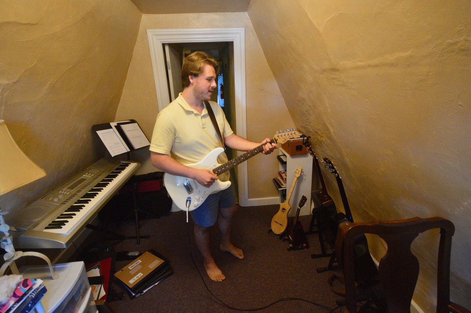 Nicholas Quigley plays electric guitar in his apartment’s tiny music studio that’s crammed with other instruments. He used guitar as a counterpoint to nature sounds he heard during a walk at Gooseberry Island in Massachusetts.