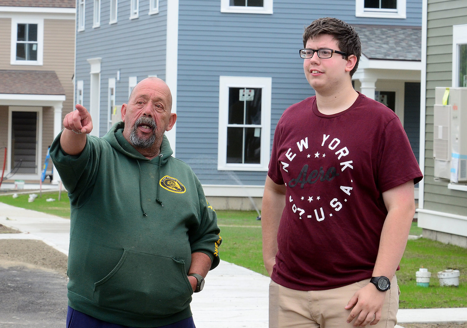 Tony Carvalho and his son David, 18, check out apartments during Palmer Pointe's open house last Friday. 
Mr. Carvalho, a Seekonk resident, is moving into a two-bedroom unit. "I'm very excited. They look fantastic," Mr. Carvalho said. "I'm trying to figure out which unit it is so I can figure out the furniture and space."