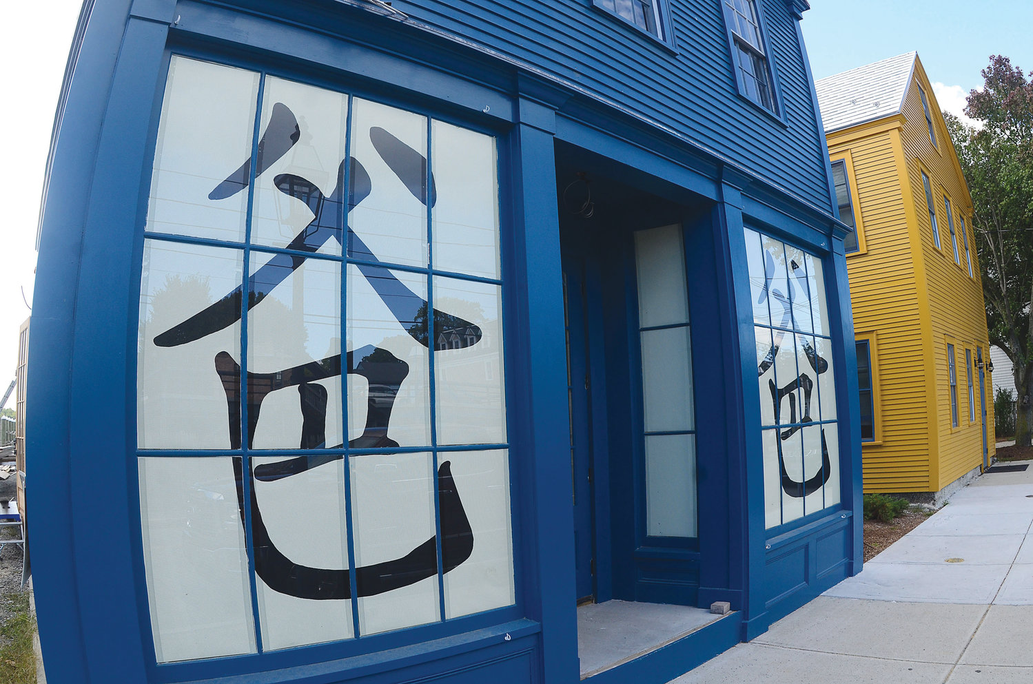 Are these Baba Sushi restaurant windows artwork or signs? The manager of the town-owned property says one thing, while the town zoning officer says another.