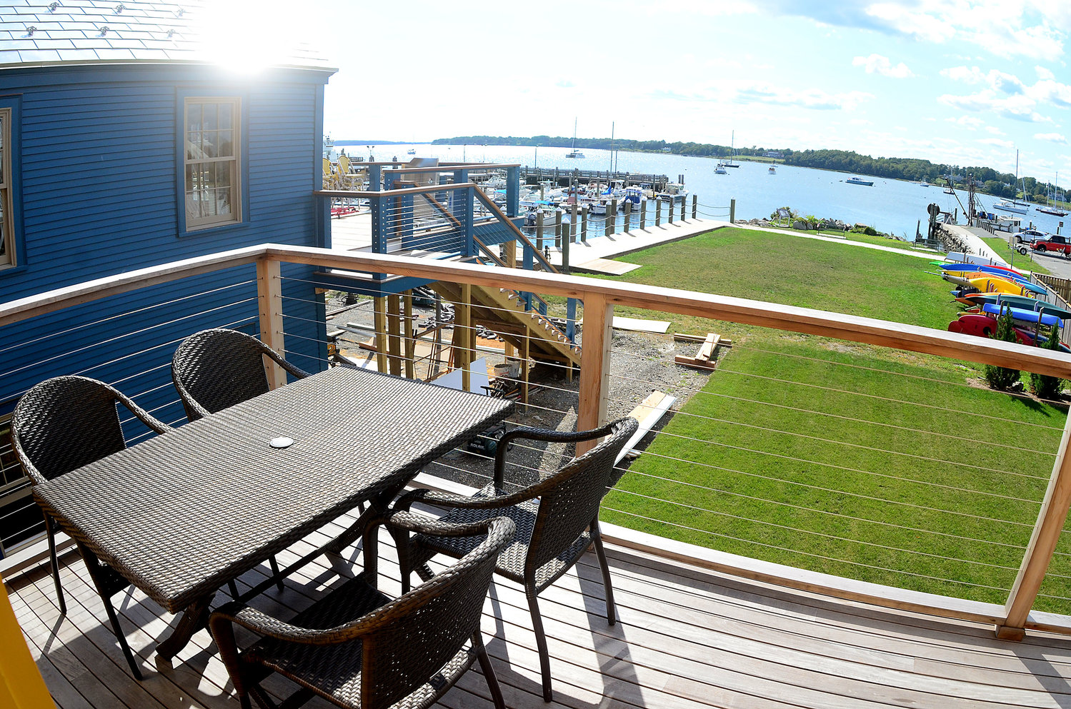 The view from the second-story deck of 211 Thames St., overlooking the State Street dock and Bristol Harbor.