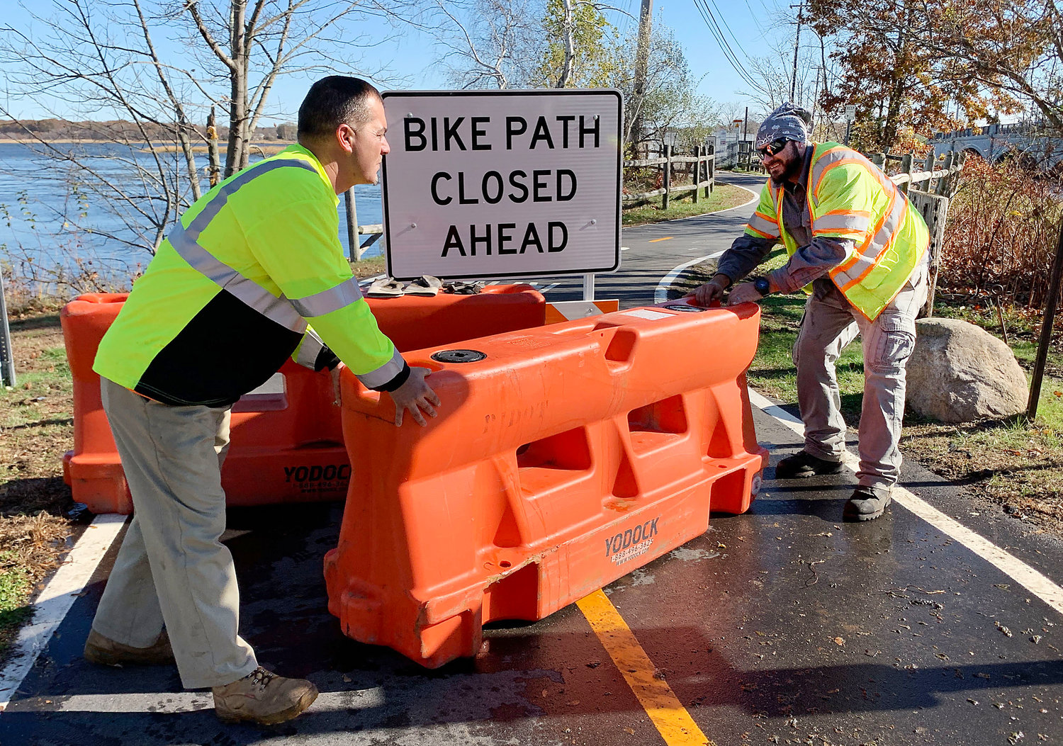 RIDOT workers block off the Warren bike path bridge on Friday morning, making the bridge impassable to cyclists and walkers till further notice.