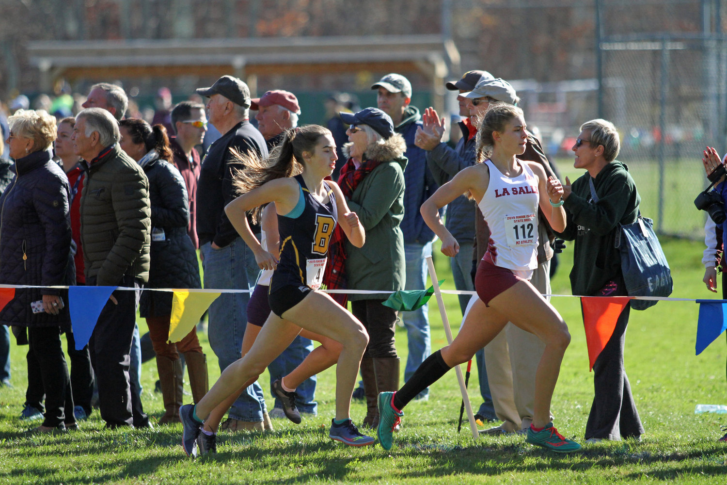 Barrington High School's Caroline Livingston runs a step behind LaSalle's Kayle Armitage during the state cross country meet on Saturday.