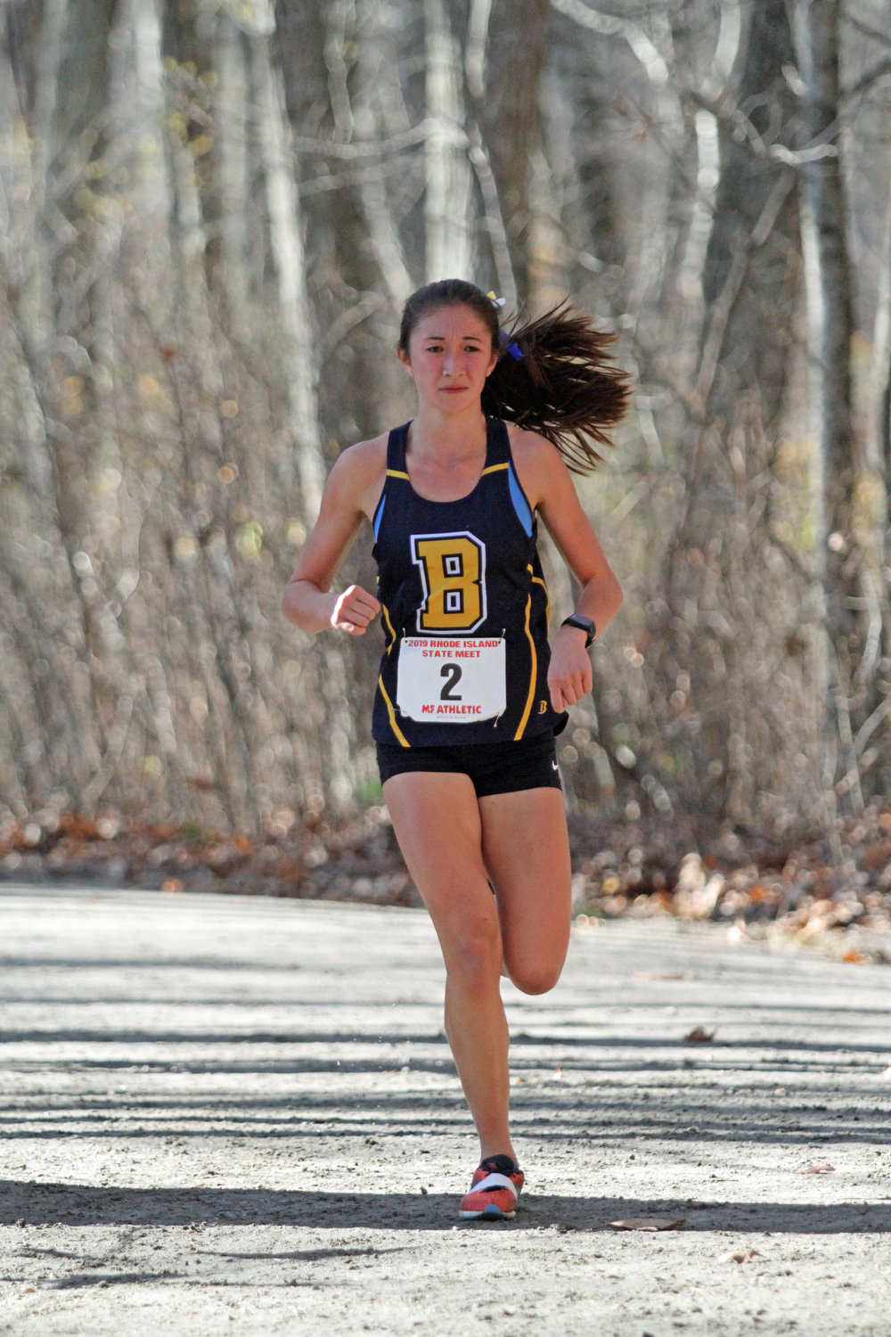 Barrington High School's Stephanie Chun competes in the state cross country meet on Saturday. Stephanie finished fourth overall and the Barrington girls team finished second.
