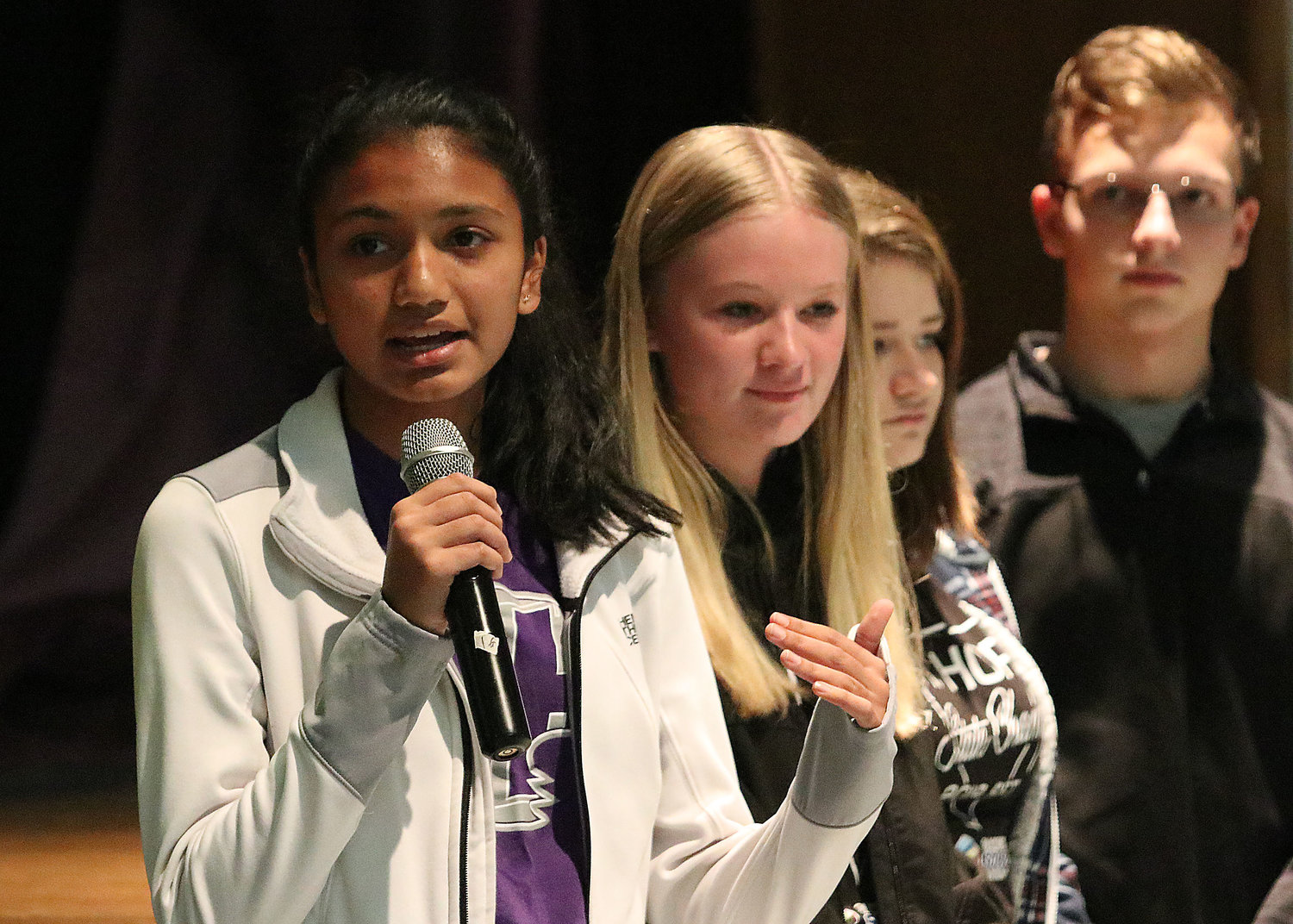 Sophomore Aditi Mehta speaks about Mt. Hope High School, while fellow students, Kristiana Cabral, Mikayla Ricks and Jacob Perry look on.