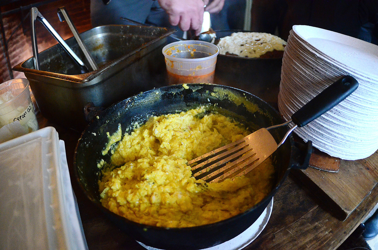 An egg dish prepared by restaurant owner Ben Sukle on an historic open hearth for his Birch and Oberlin employees at Coggeshall Farm on Tuesday.