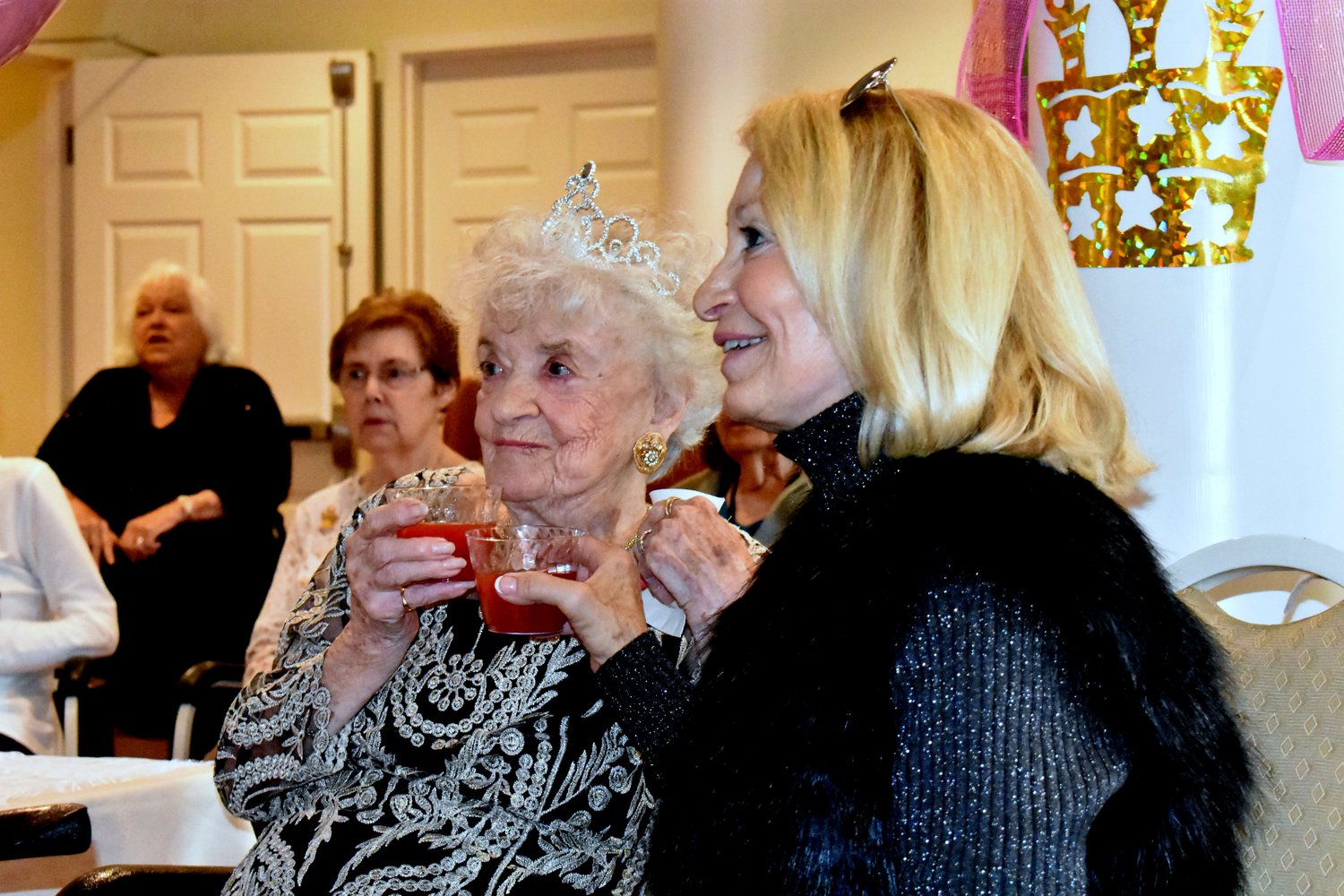Maureen Mulvany (right) came across the country from California to toast her mother’s 100th birthday this week.