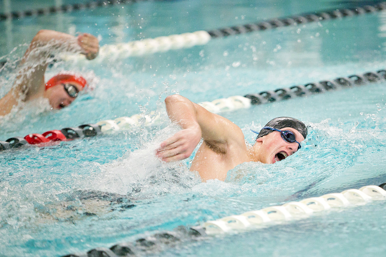 Jacob Perry takes the lead against his East Providence opponent while competing in the boys’ 200 freestyle event at a recent meet.