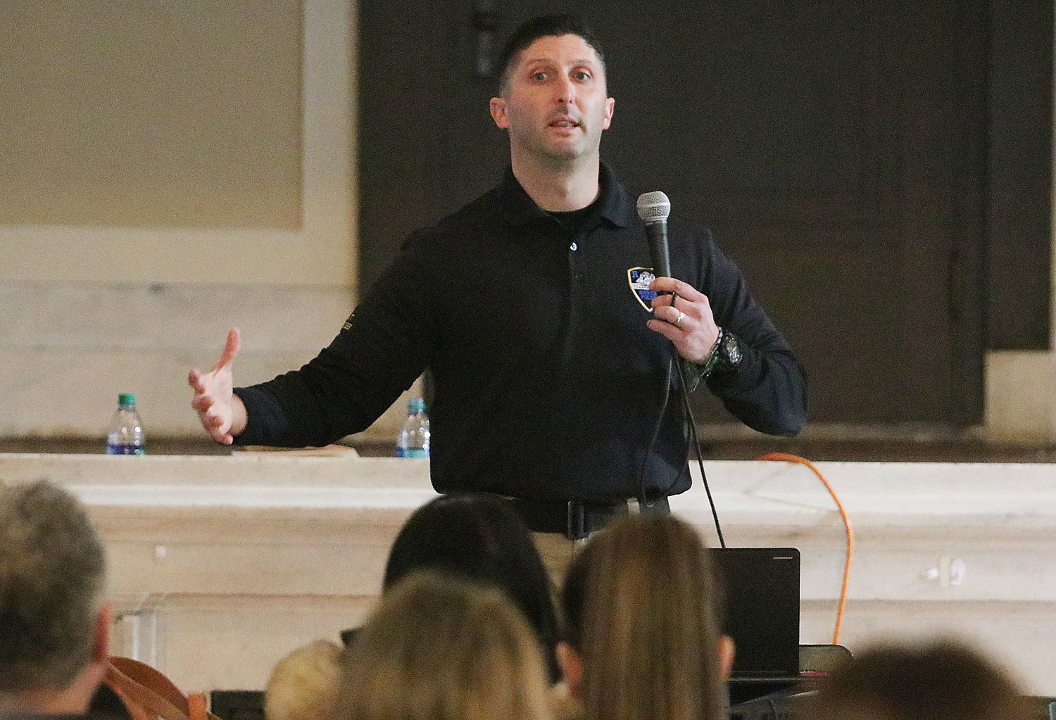 Lt. Steven St. Pierre speaks to teachers in the Colt School auditorium during an active shooter training at the school on Thursday.