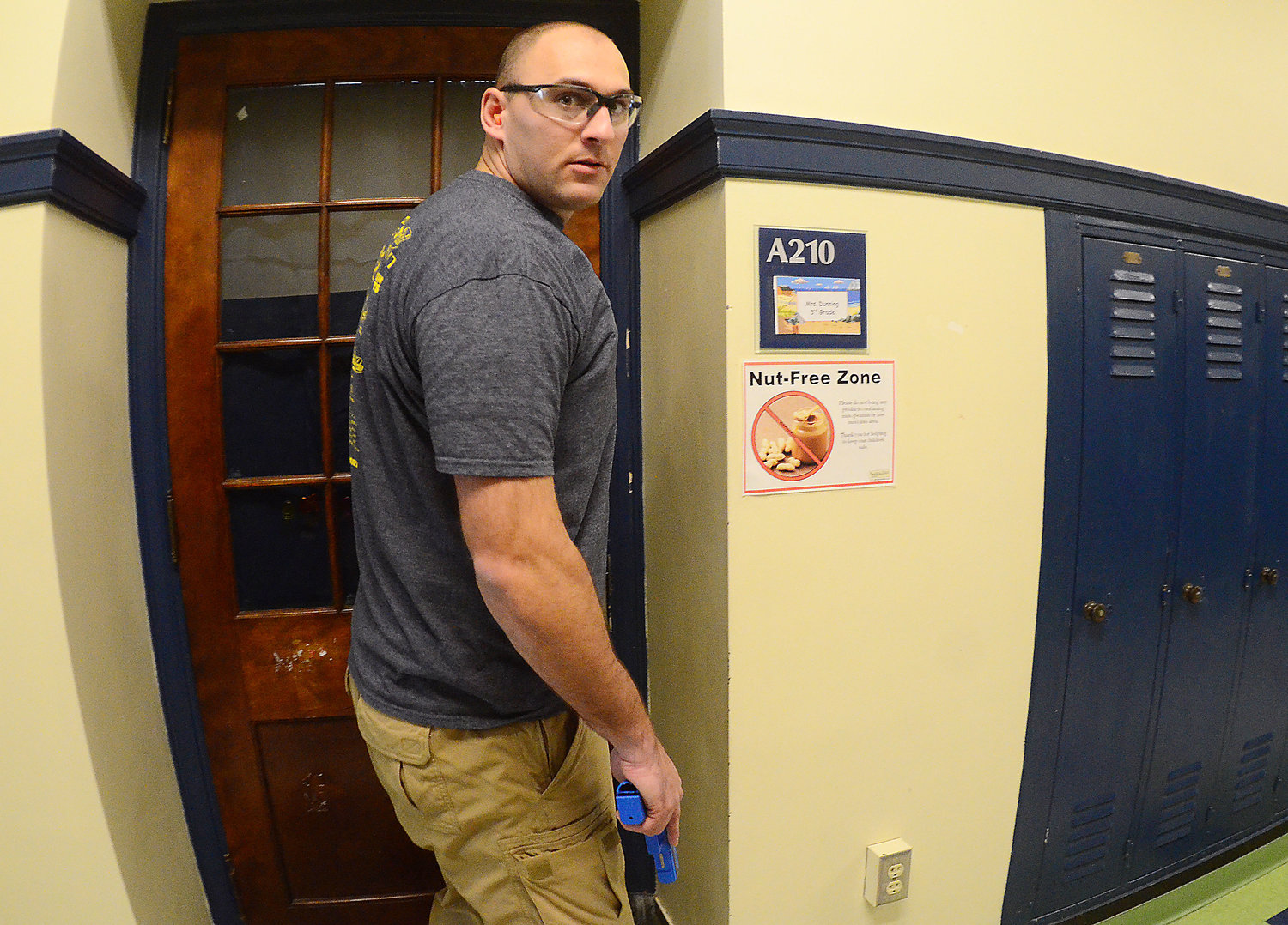 Bristol Patrolman Josh Rosa plays the role of an active shooter inside Colt Andrews School, during a training session involving staff and security forces last week.