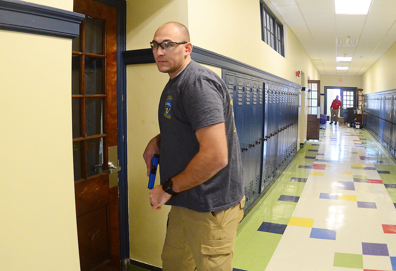 Bristol Patrolman Josh Rosa plays the role of an active shooter inside Colt Andrews School, during a training session involving staff and security forces last week.