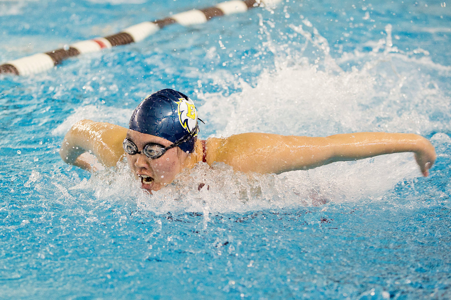 Amy Zhao swims the butterfly portion of the 200 medley at the state championship meet, Saturday.