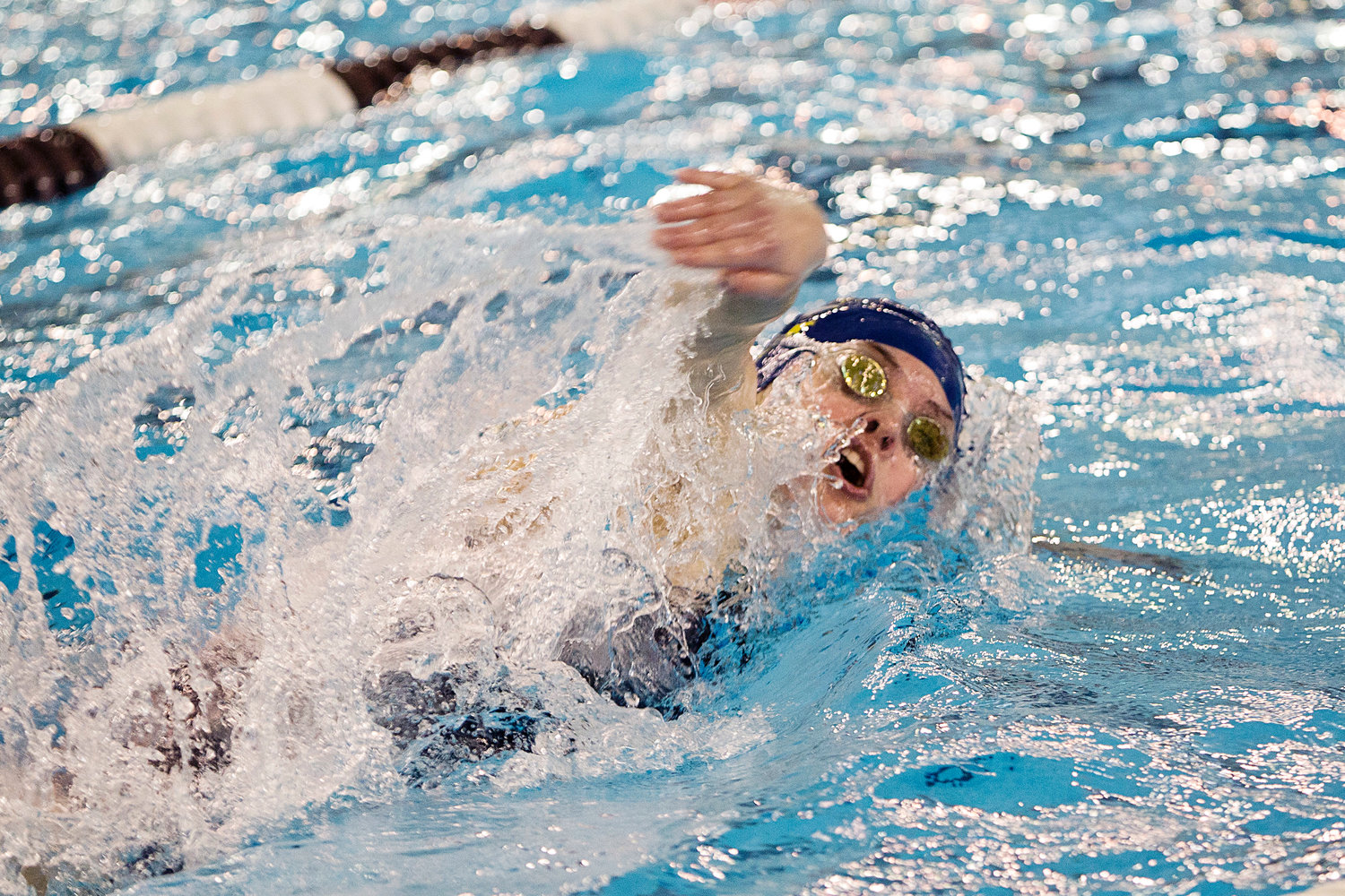 Sydni Diehl turns for a quick breath while competing in the 100 freestyle event, at the state championship meet, Saturday.