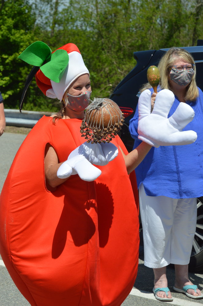 Nicole Pascoe, a social worker at Hathaway School, donned an apple costume for the occasion. Face masks bearing an apple design were also handed out.