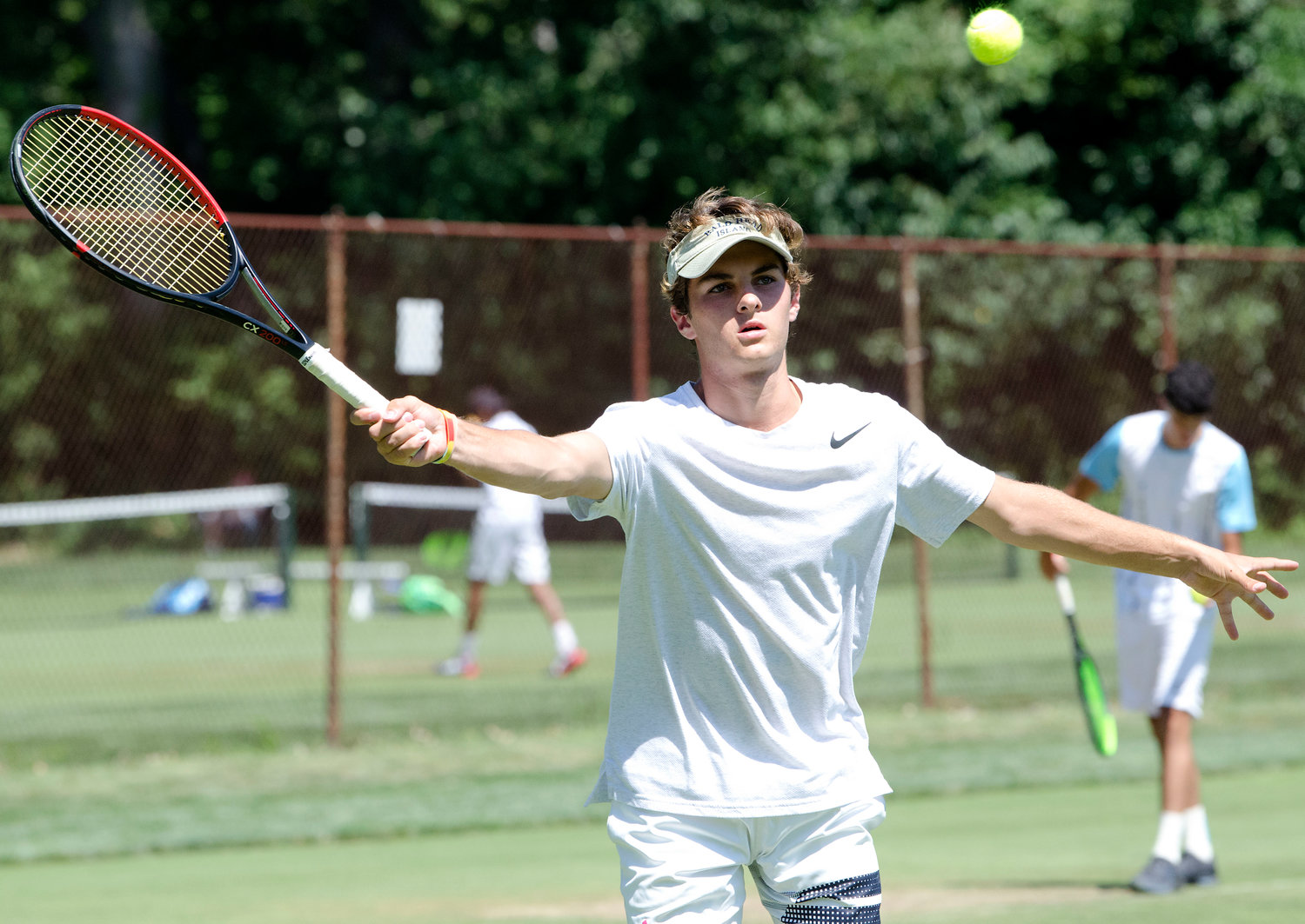 Alex Visser competes in singles at the Second Annual New England Grass Court Open Tourney.
