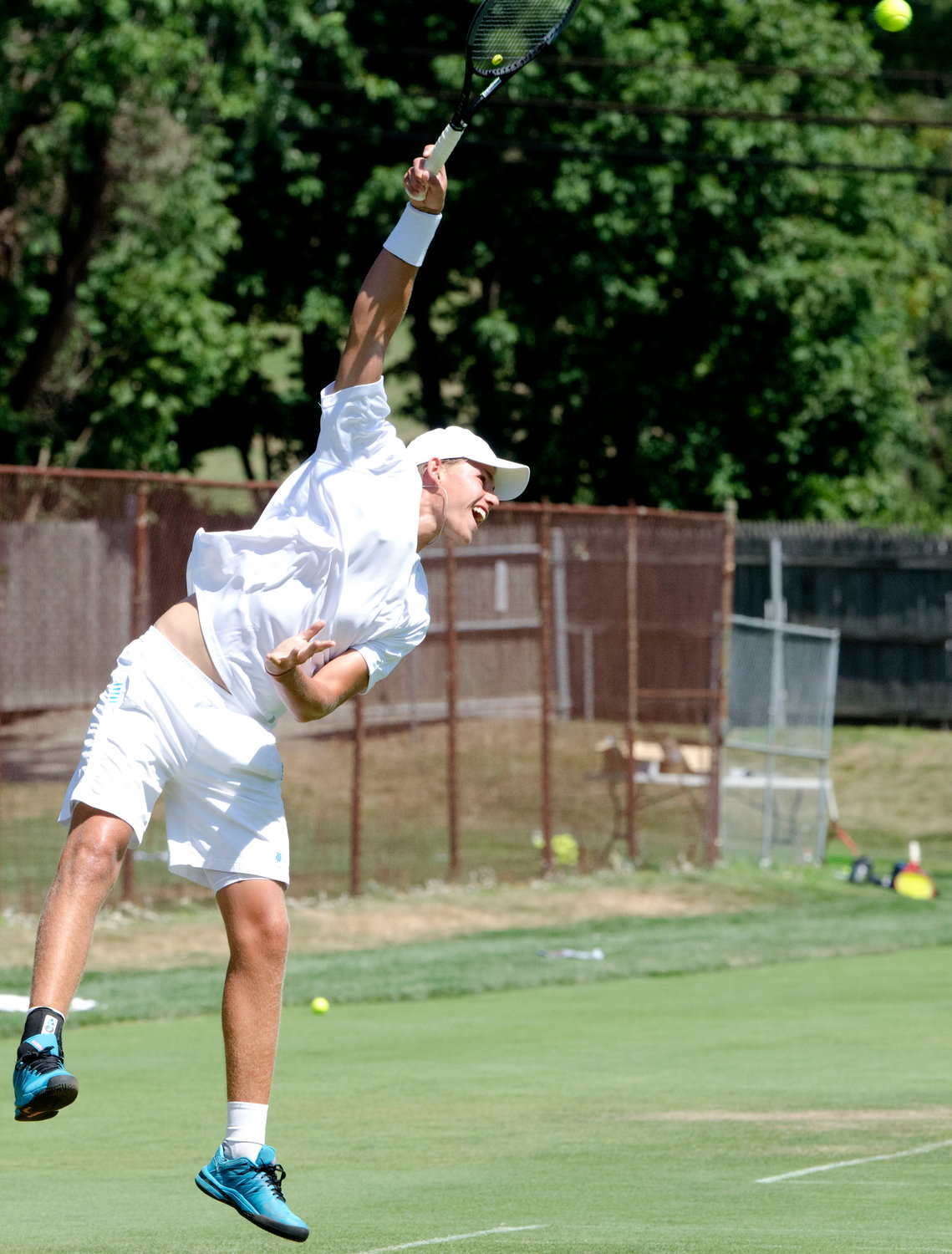 Danny Milvasky serves during singles play in the Second Annual New England Grass Court Open Tourney at the Agawam Hunt Club. Milvasky would later suffer a broken ankle in his semifinal match against eventual champion Matt Kuhar.