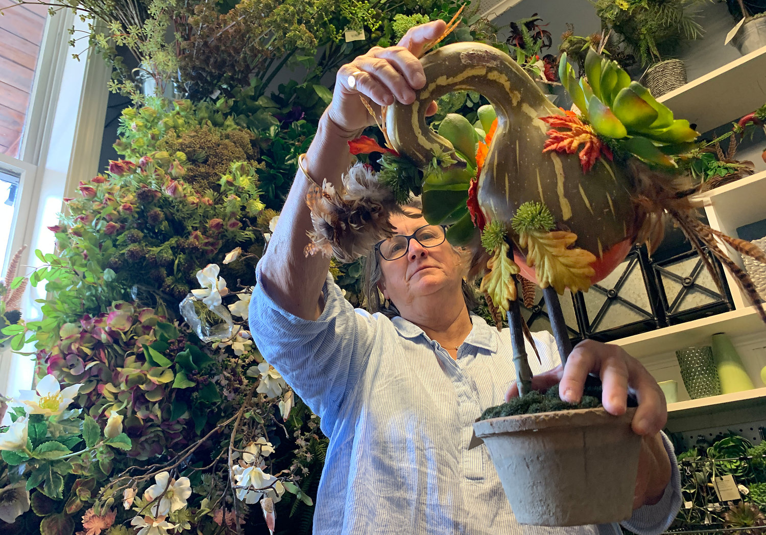 Tish Bodell Hopkins perfects a creation in her “stem room,” where clients can come select the stems they’d like in custom arrangements.