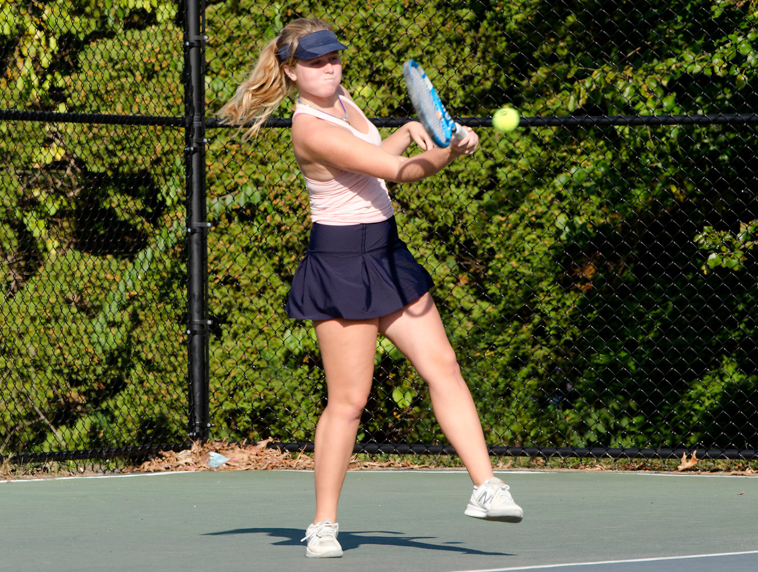 Caroline Maher, shown hitting a forehand shot, played a challenge match against teammate Kate Robertson. Caroline and Kate are two of the Eagles' top players.
