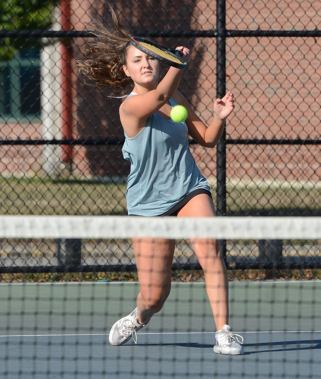 Barrington High School's Leila Beers hits a shot during a match against her teammate, Sage Wells, during practice on Monday, Sept. 21.