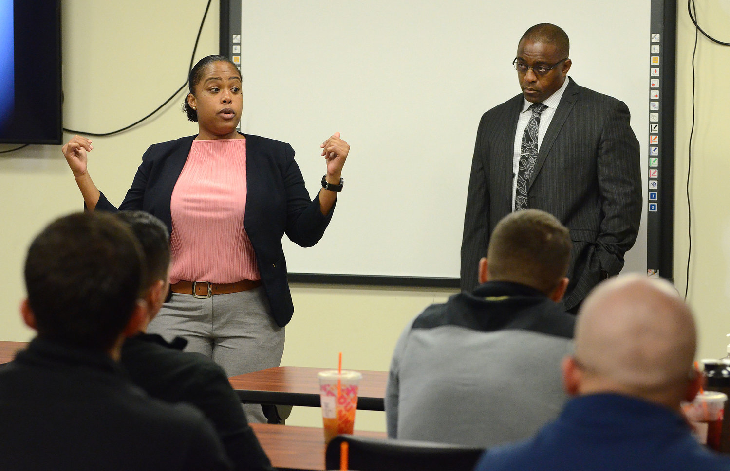 State Police training officer Krystal Carvalho (left) and State Police Sgt. Wesley Pennington talk to the Bristol officers during the Oct. 7 training.