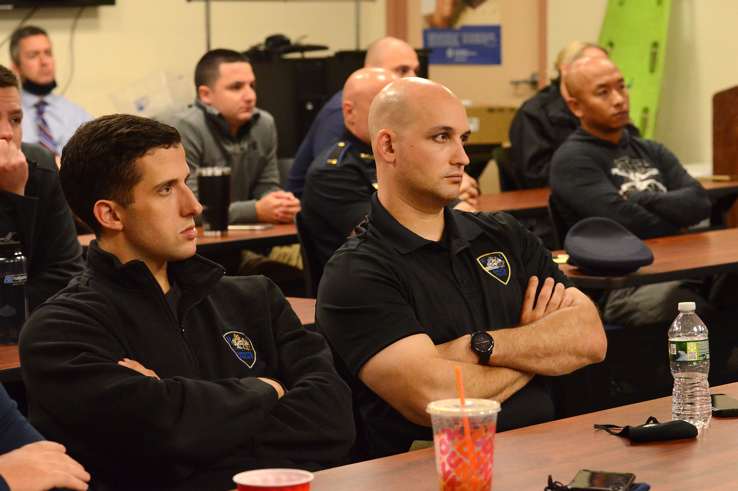 Bristol police officers (from left) Adam Almeida and Alex Booth look on as state troopers conduct a diversity training for the department on Wednesday.