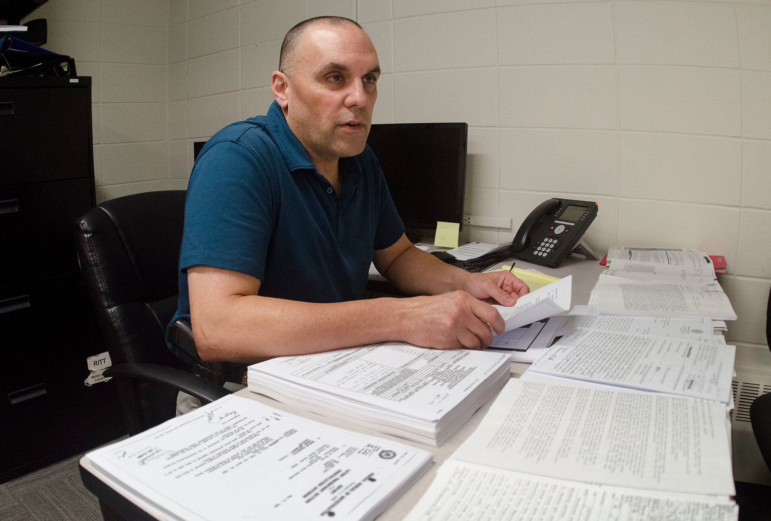 Ptlm. George Lefebvre is temporarily driving a desk instead of a cruiser, as the drop in calls permits him to turn his attention to the department’s cold case files.